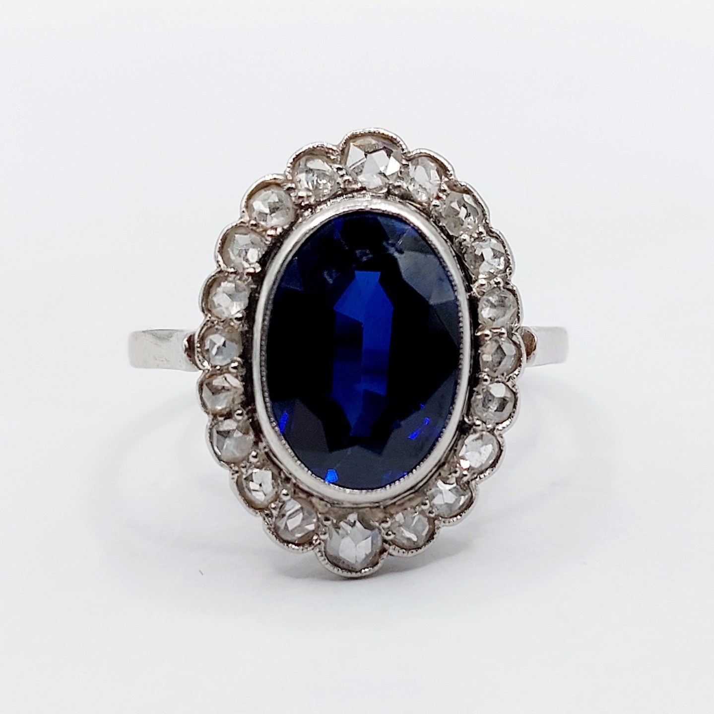 French antique daisy ring Platinum set with a 3.40 carat synthetic sapphire surrounded by 16 rose cut diamonds (circa 1910) cluster halo
PRICE : 780€
Magnificent French antique goldsmith work
Size: 56.5 FR / 7.75 US
Weight: 6.10 g
Head size: 19.7 x 14.5 mm
Sapphire size: 12 x 8 x 4.5 mm: estimated at 3.40 carats
PLEASE NOTE: Some small chips on the sapphires (see photos)
Diamond size: approximately 1.8 to 3 mm
Micro scratches from use
Dog's head hallmark and goldsmith's mark (French hallmarks)
#frenchjewelry #diamond #diamondring #antiquering #victorian #victorianring #marquisering #augustusjewels #vintagering #daisyring #daimondhaloring #sapphire #sapphirering #diamondhalo #pompadourring #baguepompadour