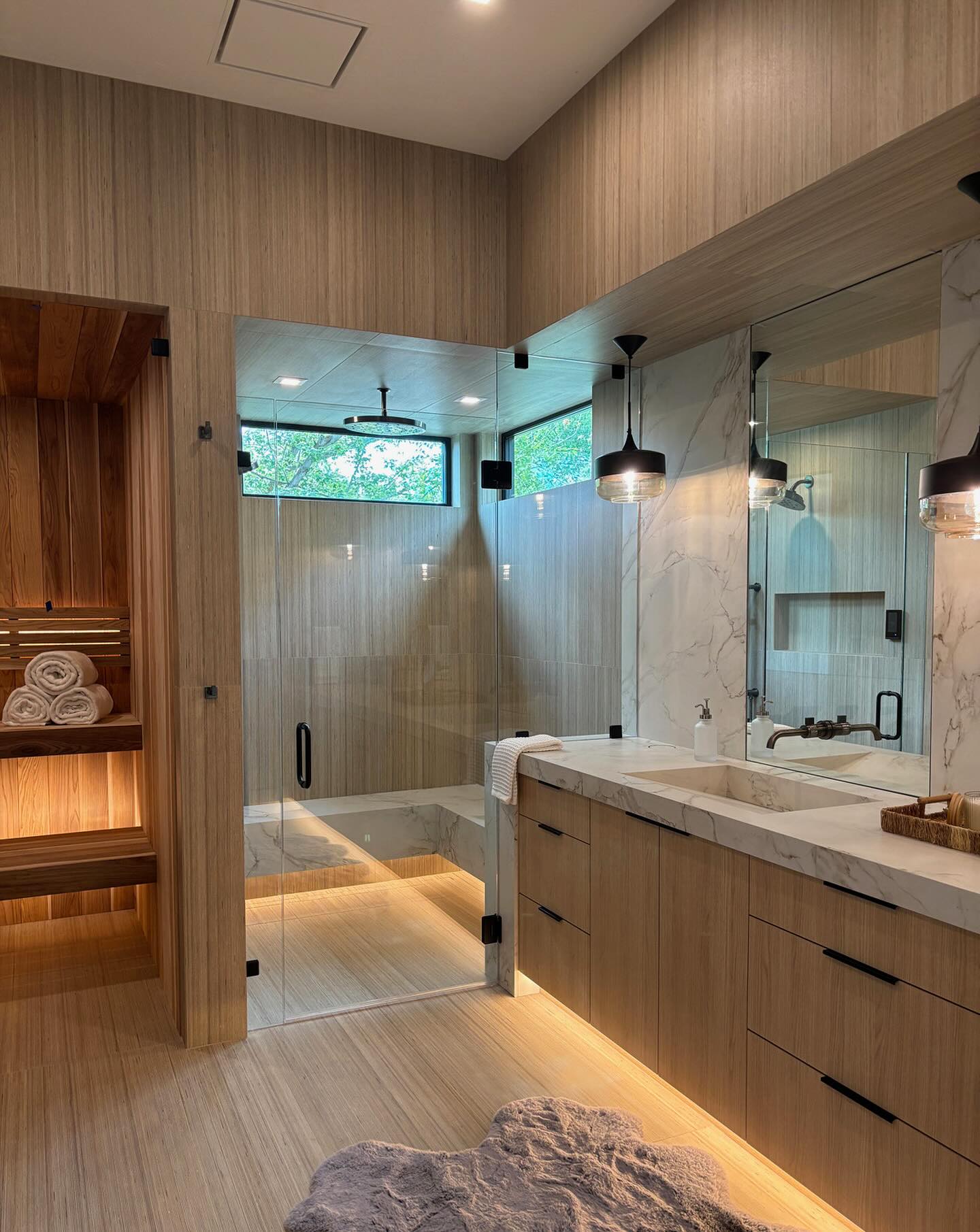Luxury Master Bath With Custom Sauna has the spa vibe I was hoping to achieve for ultimate relaxation! Steam, shower, cold plunge steps away…repeat:) Seamless glass transition from vanity to shower for clean lines and unencumbered view! Arizona Tile Shibusa Series wraps the walls and ceilings. MM
@boiseparadeofhomes @urbanidahollc @arizonatile
#spabathroom #boiseinteriordesigner #customhome #monicamachadesign