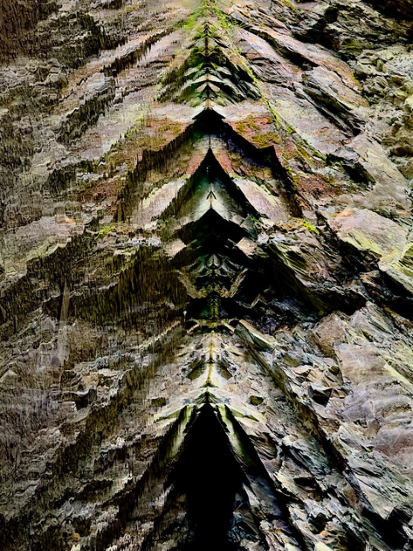Rydal Cave wall and reflection in pool turned through 90 degrees - an exercise in #pareidolia how many faces can you see? ( not AI not photoshop trick!) Above Rydal Water in the Lake District UK.