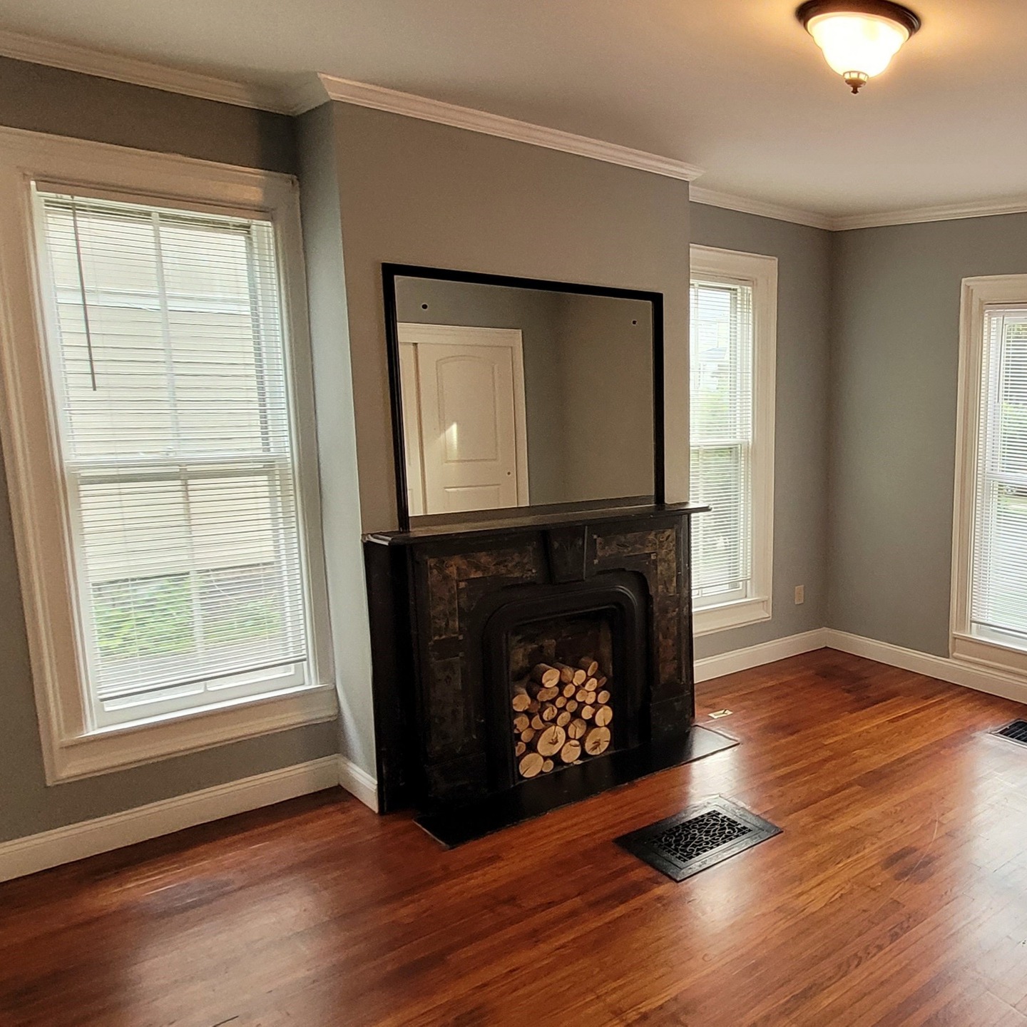 Available October! Massive 3 bedroom apartment with bonus room on the first floor of a well-kept home on Gray Street! The spacious living room features a bay window and tons of built-in shelving, leading into the large dining room with a modest chandelier. The updated galley-style kitchen features a pantry closet, oak cabinetry, new appliances, and the updated bathroom features a large tub/shower unit, large cherry vanity with granite counter, and laundry closet. The enormous master bedroom boasts a large marble fireplace, and colossal closet space. The second bedroom is still quite spacious, with its own large closet. An additional room off of the kitchen could be used as an office or third bedroom, also containing a walk-in closet. The kitchen also leads to a small set of stairs to a bonus storage room. Other features of this massive apartment include hardwood flooring throughout, beautiful modern light fixtures, high ceilings, off-street parking and private entrance in the back, as well as a private enclosed sunroom off of the front foyer of the building! Rent is $1295+ gas; with electric, water, sewer, and trash collection included in the rent.
** To apply for this apartment or for a showing, please submit an application at capriottiproperties.com **
#apartment #apartmentforrent #apartmentliving #bookshelves #builtin #capriottiproperties #crownmolding #downtownelmira #elmiradowntown #elmirany #fireplace #gothicrevival #highceilings #historicapartments #historicarchitecture #historicnearwestside #historicneighborhood #historicrenovation #historicrestoration #interiordesign #largewindows #luxuryapartments #nearwestside #sunporch #sunroom #victorianapartment #victorianarchitecture #victorianhouse #victorianhome