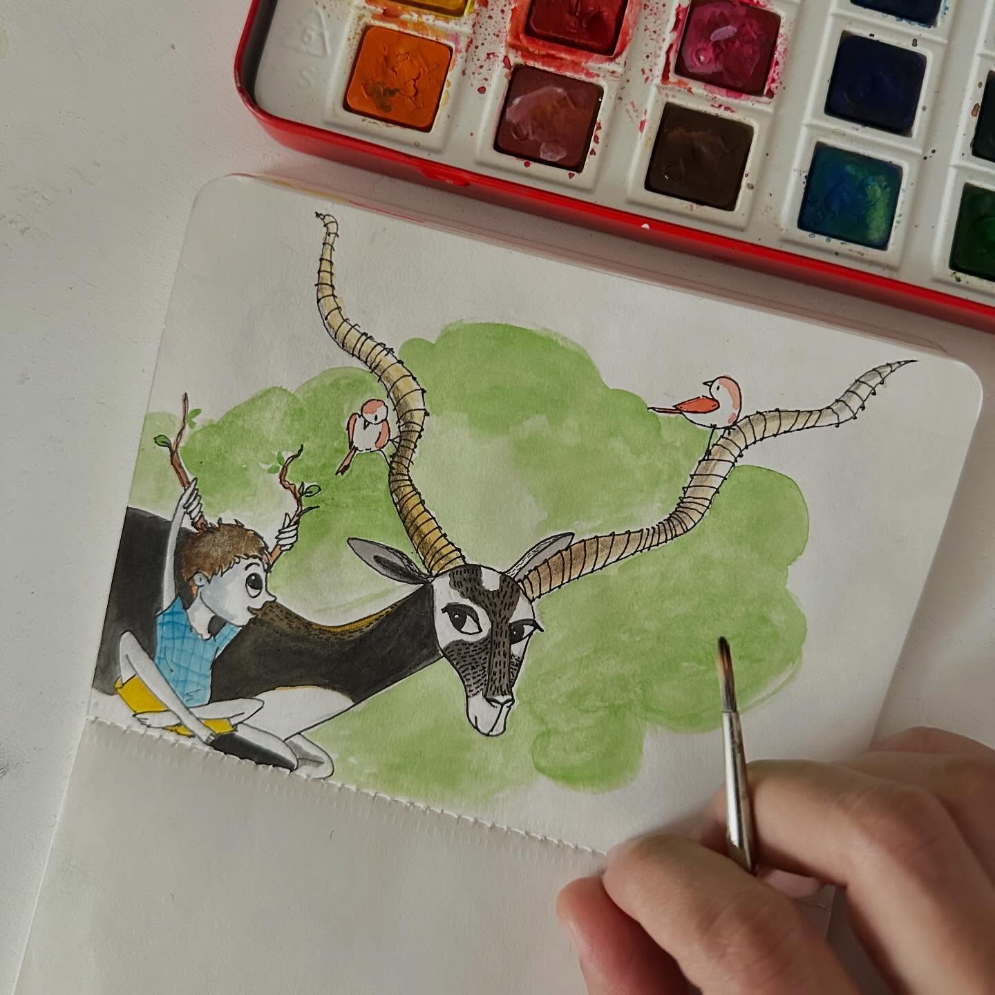 a boy, a blackbuck and birds