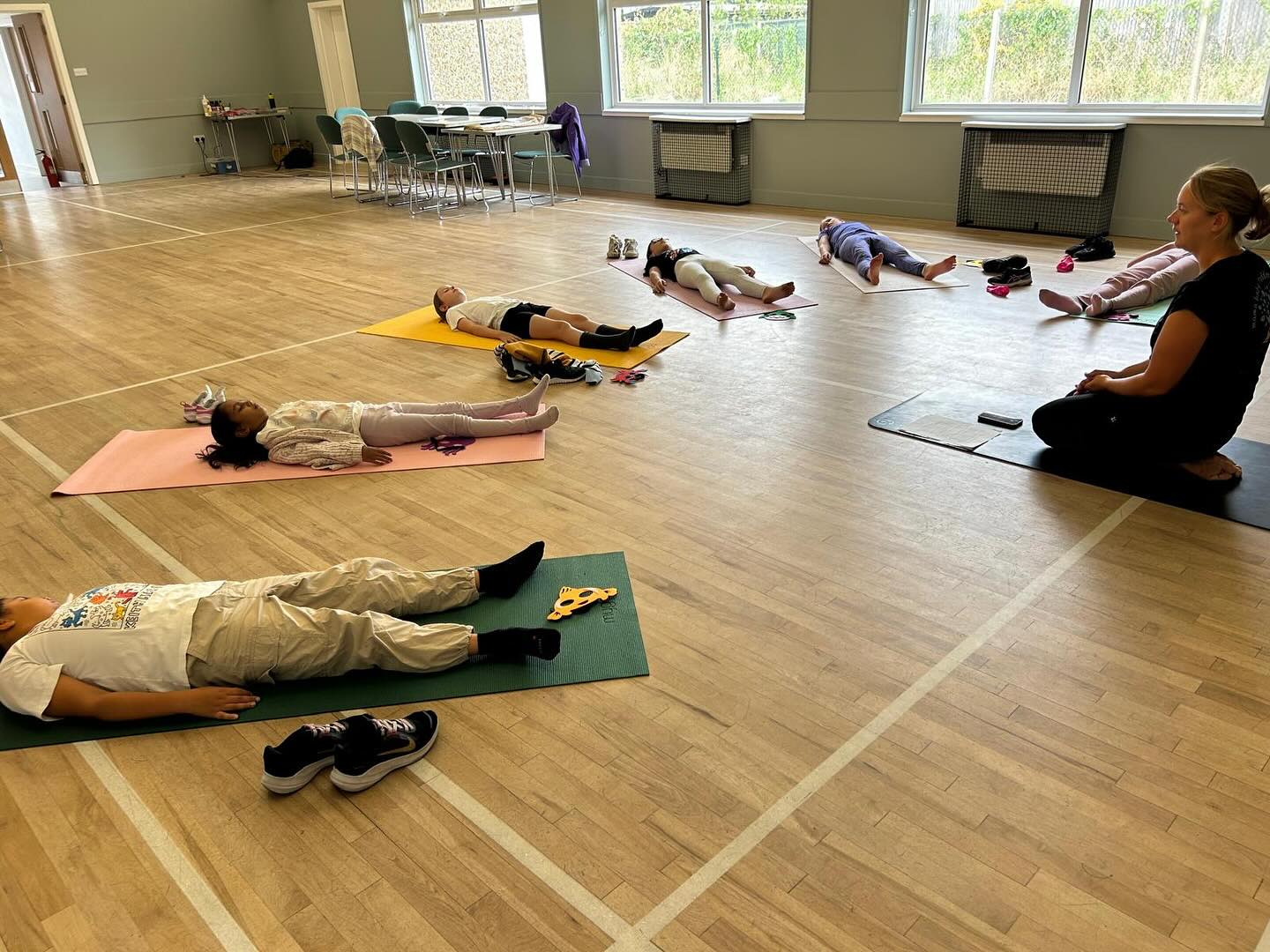 🌱 The Power of Relaxation for Children & Teens 🌱
In yoga, Śavāsana, or Relaxation Pose, is often considered the most important posture. It may look simple—lying down quietly on the mat—but for children and teens it holds incredible benefits for both mind and body.
✨ Why is Śavāsana important?
- It helps the nervous system shift from “go, go, go” mode into rest and recovery.
- It supports emotional regulation by giving children space to notice their feelings without judgment.
- It reduces stress and anxiety, allowing the brain to process and restore.
- It improves focus, memory, and readiness to learn once they return to the classroom or daily activities.
🧒 Tailoring Relaxation to Age Groups 🧘♀️
Relaxation looks different depending on the developmental stage.
At Grow, I adapt Śavāsana to meet children where they are:
- Early Years (ages 3–6): Relaxation might be guided through a playful body focus (“imagine your toes are falling asleep like little kittens”) or a short, calming story. This helps little ones stay engaged while gently winding down.
-Primary (ages 7–11): Here, we might introduce simple visualisations; floating on a cloud, resting by a river or short breathing practices. Children begin to connect the physical stillness with inner calm.
- Teens (ages 12+): Relaxation can be explored through deeper guided meditations, body scans, or visualisations that help manage stress, emotions, and the demands of teenage life. This practice fosters resilience and self-awareness at a stage when they need it most.
🌟 By making Śavāsana accessible and age-appropriate, we give children and teens a lifelong tool for calm, clarity, and wellbeing.
#yogaforchildren #yogaforteens #thegrowconcept #relaxation