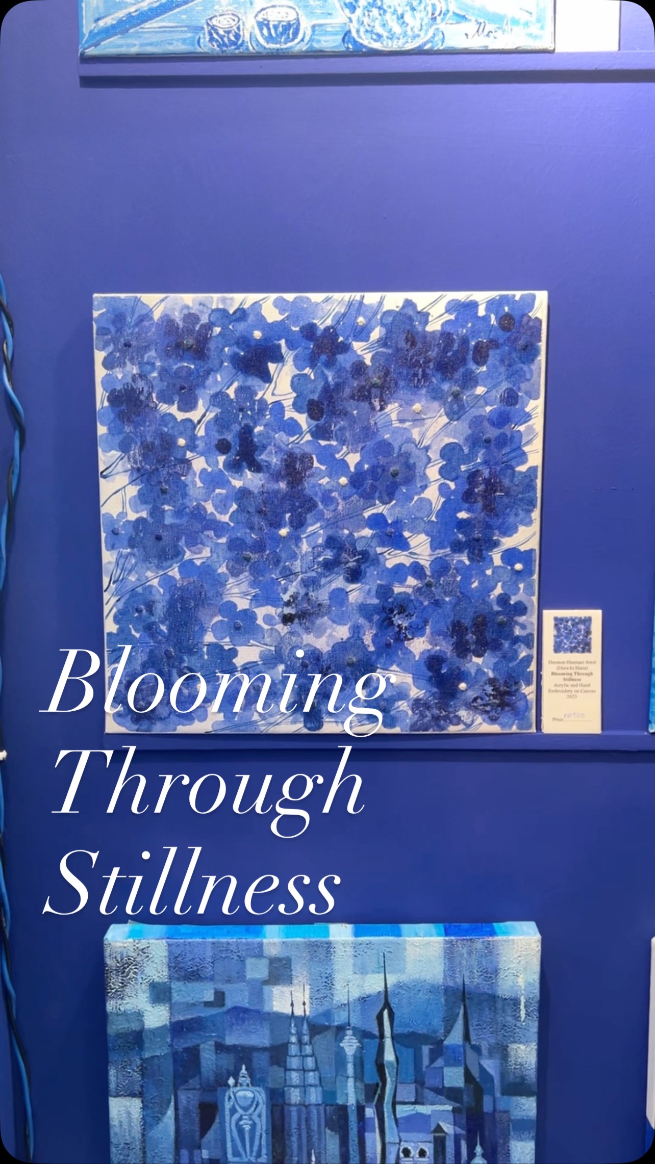 Title: Blooming Through Stillness
For Kita Orang Blue and White 400 2025 International Group Exhibition.
- This work is a contemporary abstraction inspired by the resilient spirit of the plum blossom, a revered motif in Ming dynasty porcelain. Rather than depicting the flower in literal form, I sought to channel its emotional and symbolic essence, the strength to bloom through winter and the quiet defiance of beauty against harshness.
The organic repetitive brushstrokes and layered crimsons represent petals in motion—alive, trembling, yet grounded. The white spaces are intentional, drawing from the liubai (留白) tradition in classical Chinese painting, where silence and pause give form its meaning. This visual rhythm mirrors the organic, non-linear flow of plum branches as painted on porcelain, unpredictable yet harmonious.
By abstracting the blossom and dissolving it into layered textures, I invite the viewer to see beyond the form, into the emotion and philosophy embedded in the original motif: perseverance, quiet strength, and the promise of renewal.
Look closely. Then look sideways.
The stitched dots quietly rise like echoes on petals. They are softly textured, almost hidden, until the light catches them.
Each one traces a memory, like touching something long remembered but barely seen.
The more I journey into this piece, the more it reveals itself to me.
Beneath the layers of petals and quiet threads, there’s a gentle melancholy like the echo of something once cherished, now only remembered.
It’s not sadness exactly, but a soft ache… the kind that lingers in still moments, between light and shadow.
Sometimes, I think the textures hold memories better than I do.
#DuraKiHana #kitaorangblueandwhite400 #artshowcase #abstractart #GardenofHopes #embroidery #contemporaryart