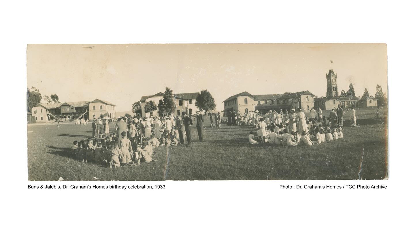 Buns & Jalebis, Dr. Graham’s Homes birthday celebration, 1933
Photo: Dr. Graham’s Homes / TCC Photo Archive
This photograph, taken in 1933 by The Kalimpong Store the town’s oldest photo studio captures a birthday celebration at Dr. Graham’s Homes. Children are seen gathered on the school grounds for the distribution of buns and jalebis, a tradition that continues even today.
Such images hold layered meanings. On one hand, they reflect the joy and rituals of childhood within the institution; on the other, they remind us of the school’s origins as St. Andrew’s Colonial Homes, founded in 1900 as a refuge for Anglo-Indian children those born to Indian mothers and European fathers who often abandoned them, leaving them excluded from both colonial and local societies.
Marking the school’s 125th birthday today invites us to view photographs like this not only as records of continuity but also as windows into the colonial histories that shaped institutions in Kalimpong and beyond. The buns and jalebis simple, shared food symbolize warmth, care, and belonging, yet they also sit within a history of exclusion, hierarchy, and abandonment.
To reflect on these images is to begin the work of decolonizing memory: acknowledging how colonialism structured lives, while also recognizing how communities reclaimed and reshaped such institutions over time.