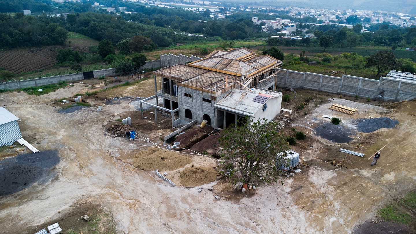Check out these recent drone photos! Every day things are taking shape more and more as construction continues progressing more and more every day!
From these photos you can see how much the transition home is coming together! Both the upper and lower complete homes are looking great with hundreds of details being worked on every day!
We are also really excited that construction has begun on the Redeemed Steel trade school!
Also, the well drilling is complete and final details are being worked on, we praise God for this provision!
As well, the septic tanks are installed and the system is connected!
Plus, you can see the all the platforms created for each building to come.
We celebrate all this progress and ask you to join us in thanking God for all that’s happened and for all that is still needed.
Projected Timeline;
May 2026- Trade School construction done…praying for logistics and provision in getting all equipment on site.
June/July 2026- Transition Home done and ready for Smith family to move into lower home as house parents and prepare to receive girls into upper home.
Please Pray with us in all of this 🙏🏼