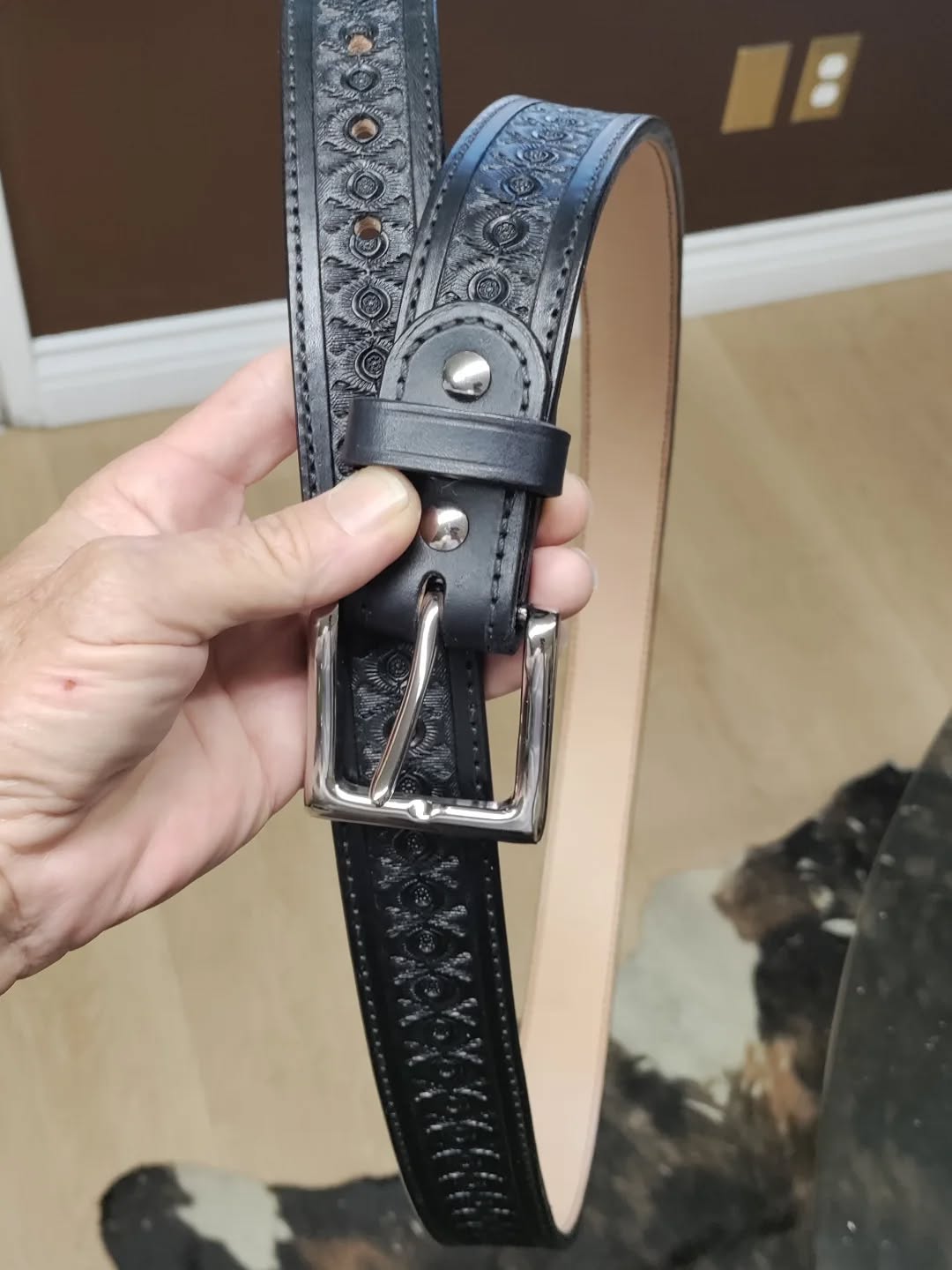 An oldie but goodie design of mine from the 1990s. "The original Lifetime Belt", before there was such a thing. Hand tooled and hand dyed. Fully lined, 13 oz total leather thickness. Size 54 😳. If you're a big guy, come see us!