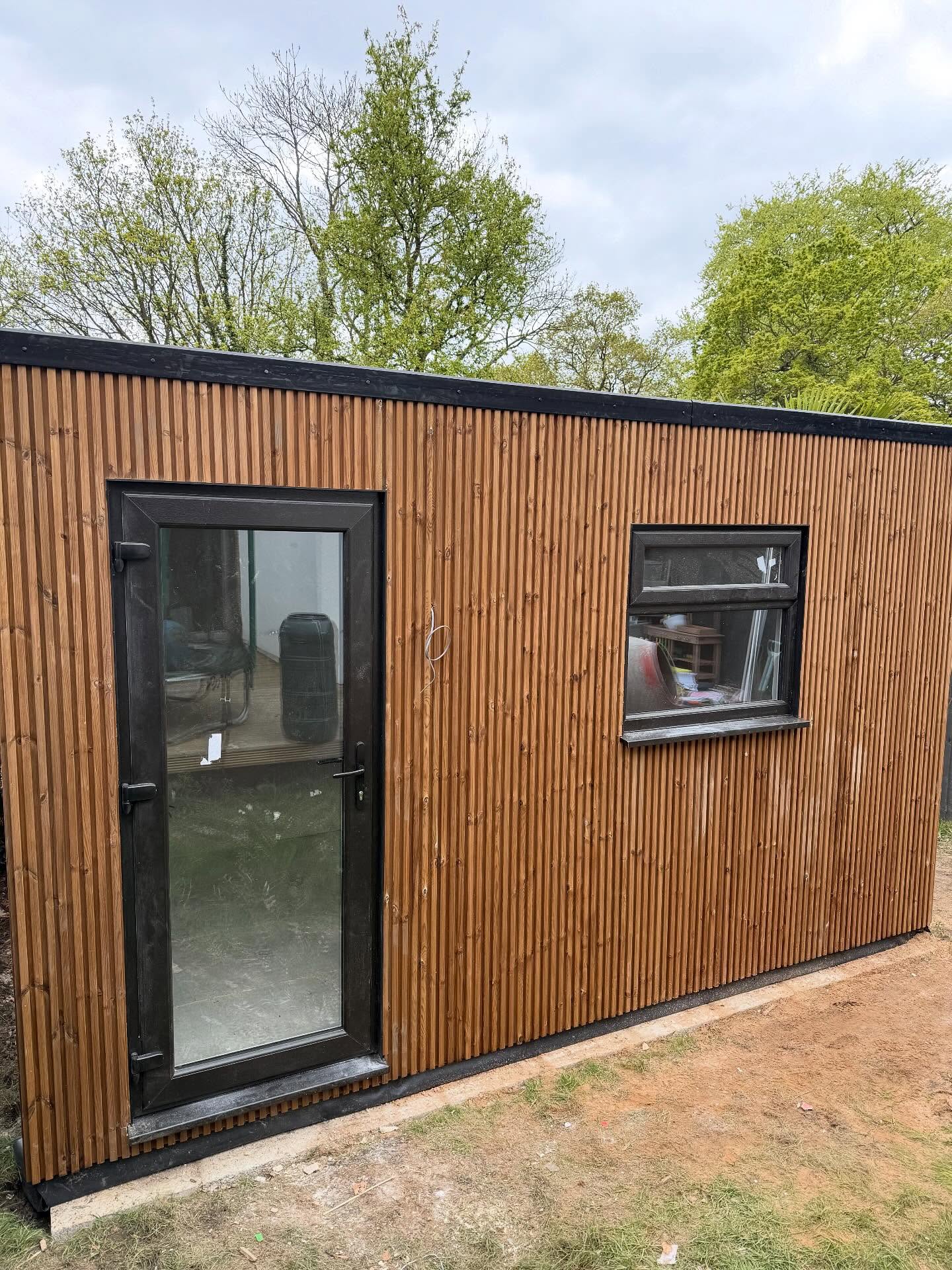 We built a custom garden office with a timber clad finish. Complete with heating, full electrics and data connections