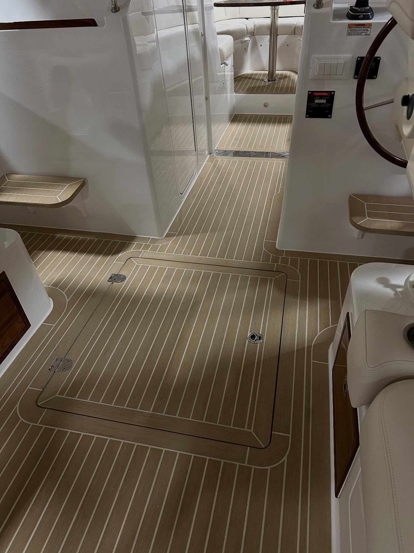 A perfect blend of CNC technology and traditional craftsmanship result in a beautiful synthetic teak deck for every MJM Yacht. #ebersoldboatworks #yacht #syntheticteakdecking #yachtlife