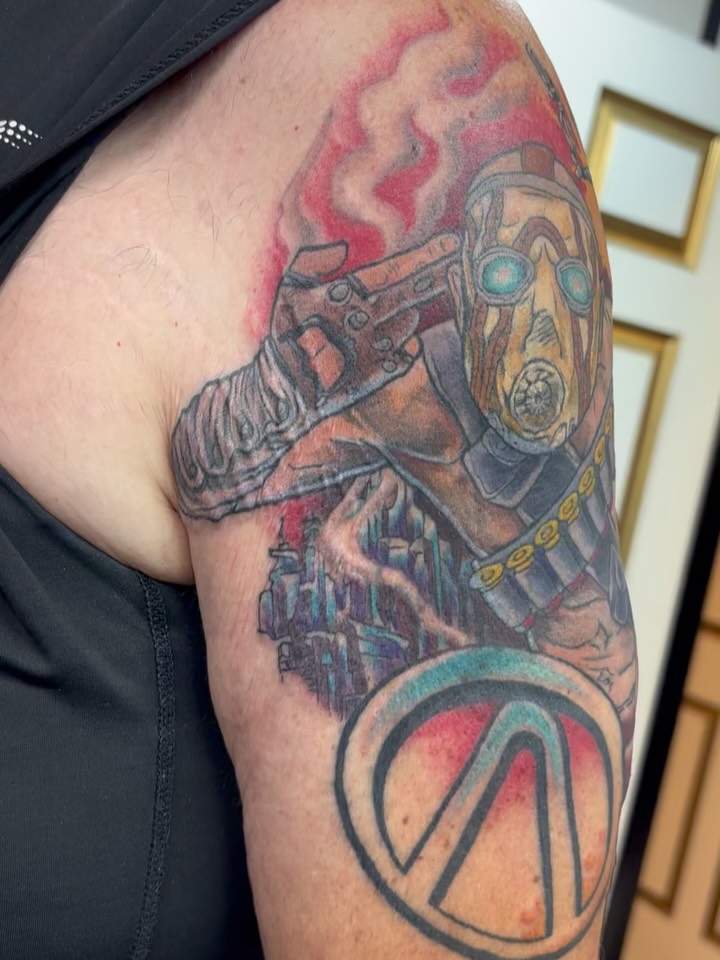 Rad Borderlands project wrapped up! Absolutely love how the colors turned out on this ✨✨✨ Video game stuff is right up there with the anime stuff for me: I LOVE tattooing it!!! This was also a coverup, swipe to the end to see the before. Thanks for looking 🗡️ #tattoo #customtattoo #gamertattoo #colortattoo #coveruptattoo #borderlands #borderlandstattoo #gamingtattoo #gamer #queertattooartist