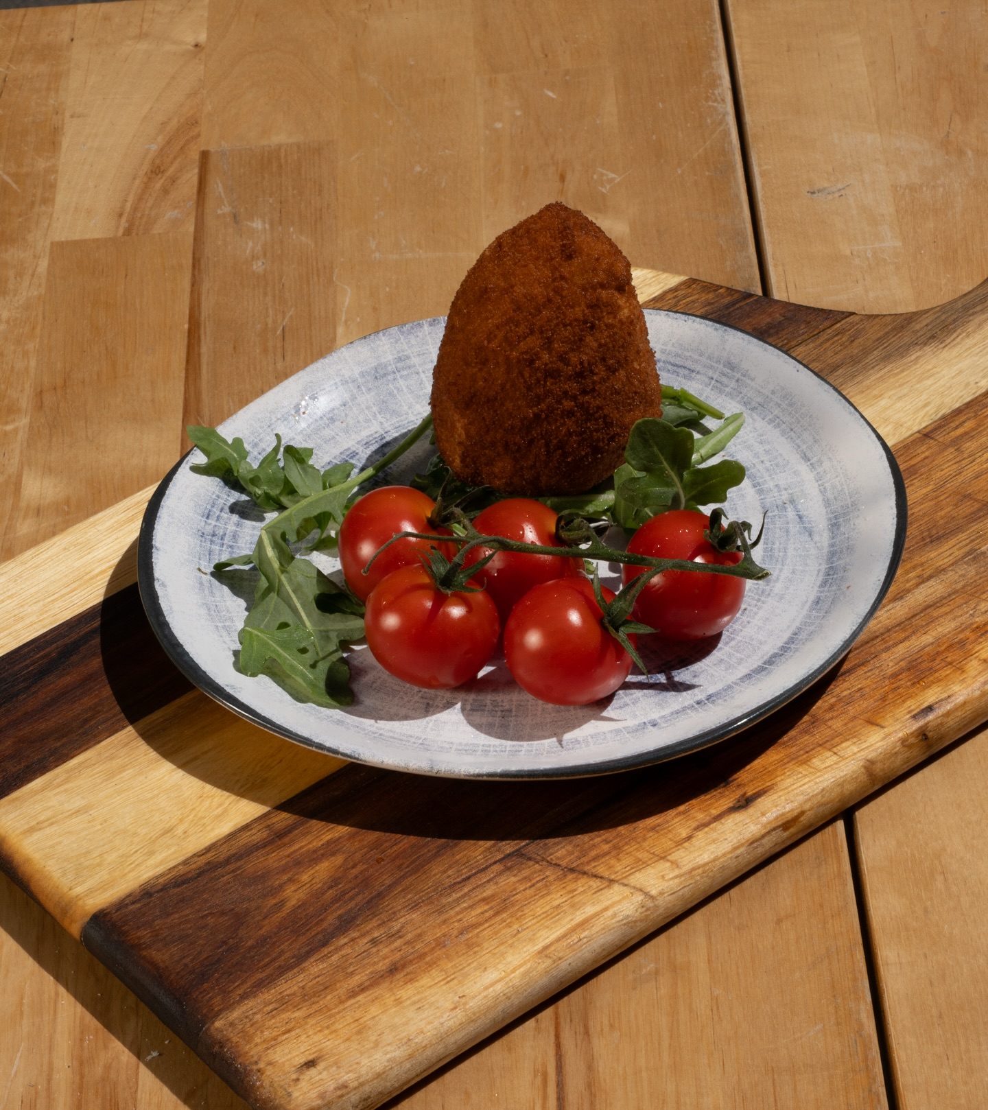 Golden, crispy outside. Oozy, cheesy inside. ✨ Arancino ! 
A little taste of heaven on a plate 😋
#Foodie #FoodPorn #CheeseLovers #StreetFood #FoodPhotography #CrispyGoodness #Foodstagram #FoodieLife #Arancini #CheesePull #TastyEats #TomatoLove