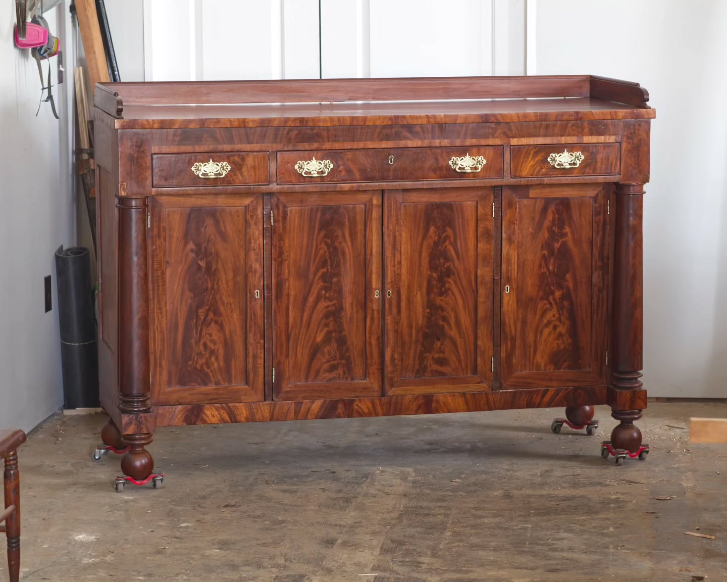 A rare Saturday-delivery of a very heavy sideboard that had some lackluster mahogany veneer around the bottom and top edges replaced with crotch mahogany veneer. Lots of older veneer repairs on the doors had to be reglued down and some minor dovetail repairs to the gallery were also completed. The finish required some work to get some color back before applying varnish to seal everything in.
#furniturerestoration #furniturerepair #furniturerestorer #mahogany #mahoganysideboard #mahoganycrotchveneer #liftwithyourback #restoredinbaltimore