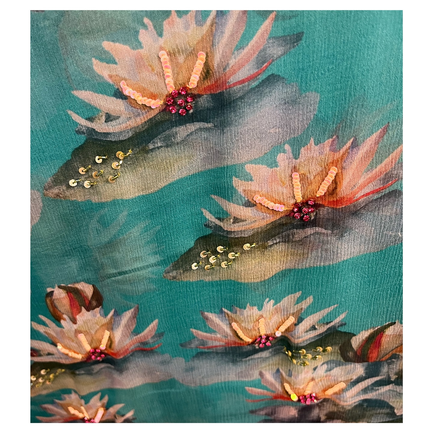 For the Goddesses of wisdom 🪷
A chiffon saree in an aqua ombre with a hint of ivory and pink - hand painted lotus flowers in bloom which are enhanced with handworked embroidery and bead work.
Digitally printed by our studio.
Part of our DEVI collection.
.
Navratri : day 9
Maa Siddhidatri is the ninth and final form of the Devi’s and is known as the “giver of supernatural powers”
And is revered as the Goddess who bestows supernatural abilities, wisdom, and ultimate fulfilment.
.
#chiffonsaree #devi #navratra #sixyardsofelegance #pinksaree #prettyinpink #floralsaree #lotus #giftsforher #wearpink #shopsmall #oneofakind #uniqueclothing #slowfashion #shopslow #shopsmallbusiness #delhifashionblogger #indiafashionbloggers #vocalforlocal #indiandesigner #shopindiandesigners #boutiqueclothing #customclothing