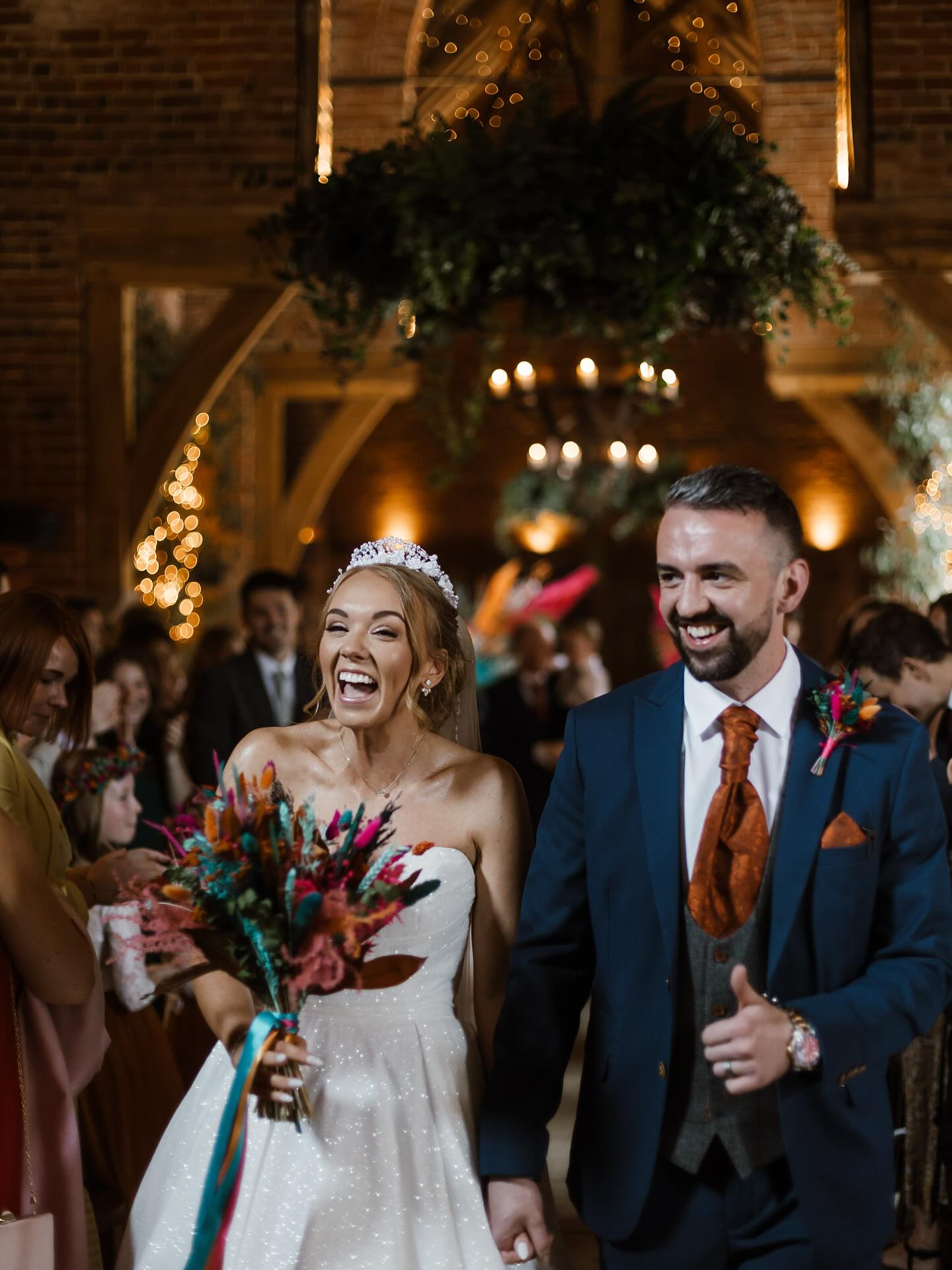 Beth and Iain’s colourful explosion of a Wedding fit their energy perfectly - they did not stop smiling, sorry belly laughing, all day. I can’t tell you enough how infectious this excitement is - they loved everything about everything and evidently, all their guests did too.
Beth also embraced everything wedding, opting for a volumous sparkly ball gown and totally owning it as she strutted about Shustoke Barn in her Loboutins (a feat of endurance for any bride). A huge banquet, magic from Jester, piano music serenading them through the day and topped off by an epic performance as always from Apollo Soul, everything was so incredibly vibrant. I don’t know what this magic sauce is that my couples bring together, but I know I’m eternally grateful that I get to capture it.
Everything and everyone they chose for their day came together perfectly, you know you’re onto a winner when the couple tell you they are having the best day, halfway through. Hats off to you two.
Here are the suppliers:
Photographer: @amyrosedeffley
Venue: @shustokebarn
Make up: @chloemccallmua
Hair: @thebohobridalco
Flowers: @ashtreefloraldesigns
Magic: @jester_styles
Cake: @irisandferncakedesign
Band: @apollosoulband