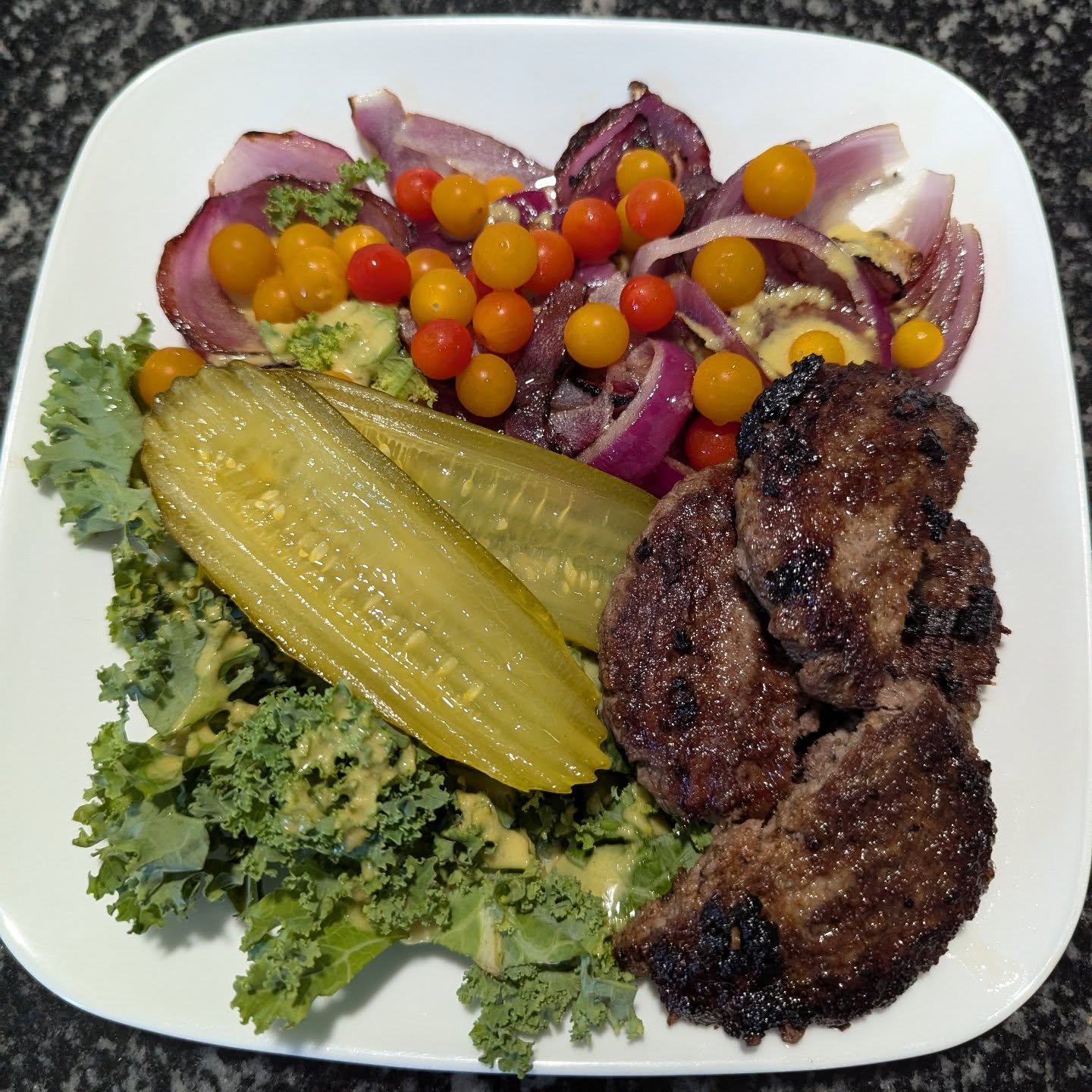 Celiac meal in less than 20 minutes! Indoor grilled two patties and an onion on 400. Grabbed a handful of kale, little tomatoes and added creamy Jalapeno from Siete which is vegan. So delicious! #celiac #glutenfree #easy #recipe #allergenfree #organic #hitsthespot