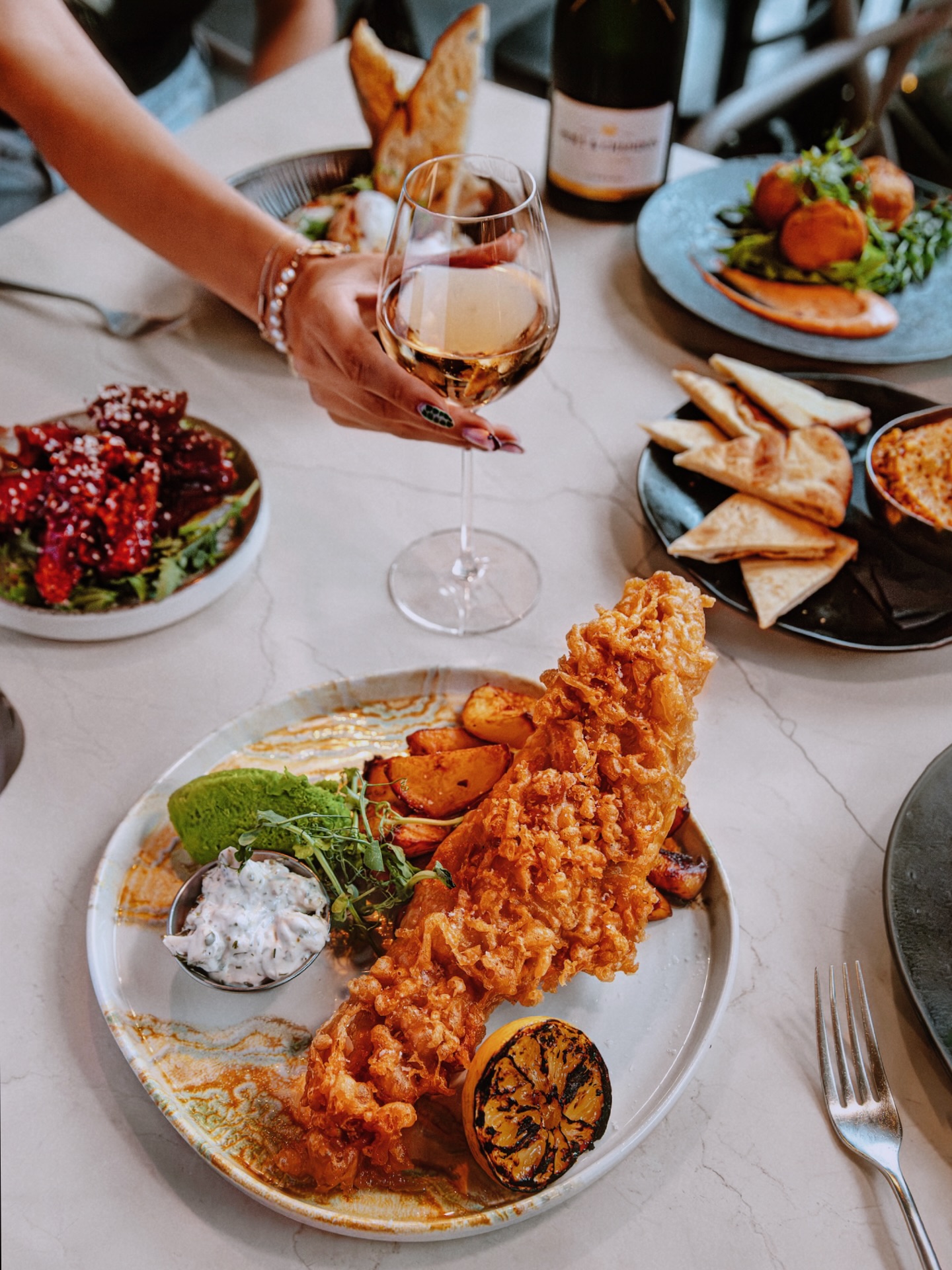 Fancy a fish and fizz?
Try out beer battered fish, famous chunky chips, homemade tartar sauce, and mushy peas , Pair it with Moët? Trust me it works !
The champagne’s brut and bubbles balance out the batter’s richness. its high acidity and effervescence cut through the rich, fried batter, cleansing the palate between bites.
…. And those brioche notes? Chef’s kiss.😘
Don’t forget we can do takeaway !
.
.
.
.
#moët #moëtchandon #fishandchips #takeaway #food #meal #manchester #manchesterspot #manchesterbars #independent #supportlocal #castlefield #deansgate #thisismanchesterawards #leadingbar #fishandfizz #dogfriendly #petfriendly