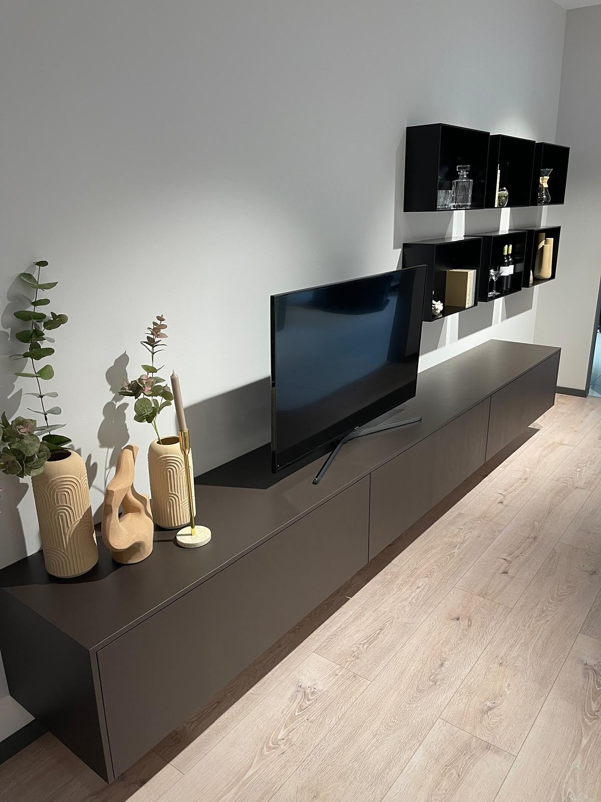 Installed as part of a recent project, this bespoke media unit was designed to feel seamless within the space. Clean lines and a muted palette conceal generous storage, while floating shelves create balance and rhythm above. The result is a refined architectural composition - functional, understated and quietly elegant.
SOHO Developments | High-end residential extensions, loft conversions & full refurbishments