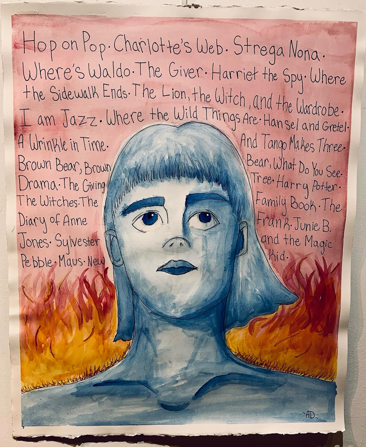 We’ll be highlighting some of the art from our Fairfield County Student Social Justice Art Showcase student ambassadors…students who participated last year and are returning this year! Check back for more inspiring art!
Students- art is due 11/2 and the and the Opening Reception is 11/8! Pre-register today, even if art isn’t ready, to learn more and get important updates!! Link is in bio.
All are welcome to attend the Opening Reception on 11/8 from 1-3pm.
Ava
New Canaan Country School
fREADOm
Water Color
My piece is about book banning. Behind the girl are titles of children’s books that have been banned for a number of irrelevant reasons. So many books are banned in the US because they are deemed offensive, just because they depict different types of people and communities. Literary censorship, especially when it comes to children’s books, leaves people uneducated. Books are for everyone to enjoy, and the content inside them doesn’t change that,