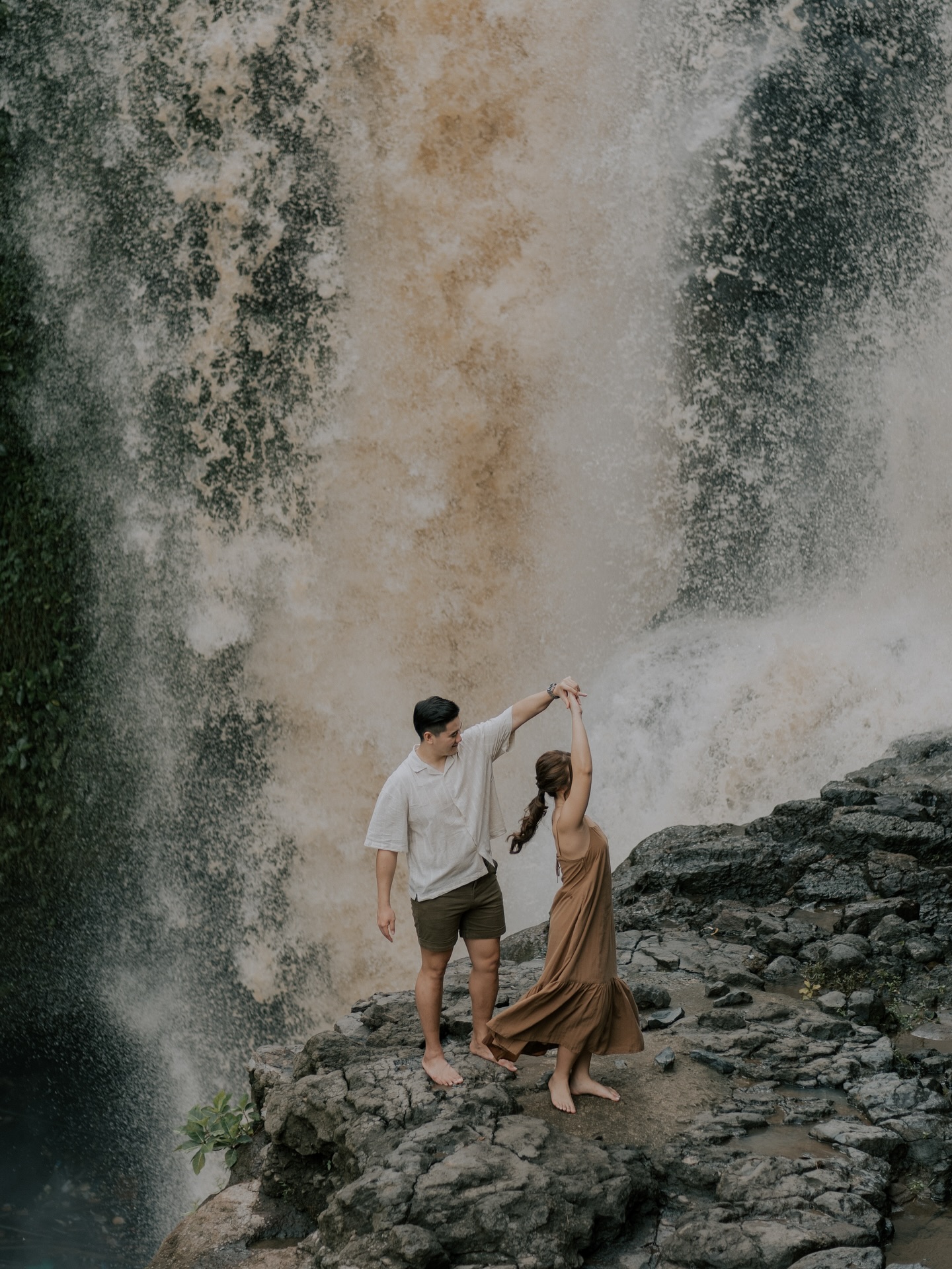 We love this set so much! It poured heavily in the morning while Valerie was getting her makeup done, but by God’s grace, the rain stopped just in time for the photoshoot. The waterfall turned a muddy brown, yet the photos came out beautifully—as if the outfits were made to match the surroundings.
What we love most about this set isn’t just the looks, but how everything unfolded exactly as it was meant to be.