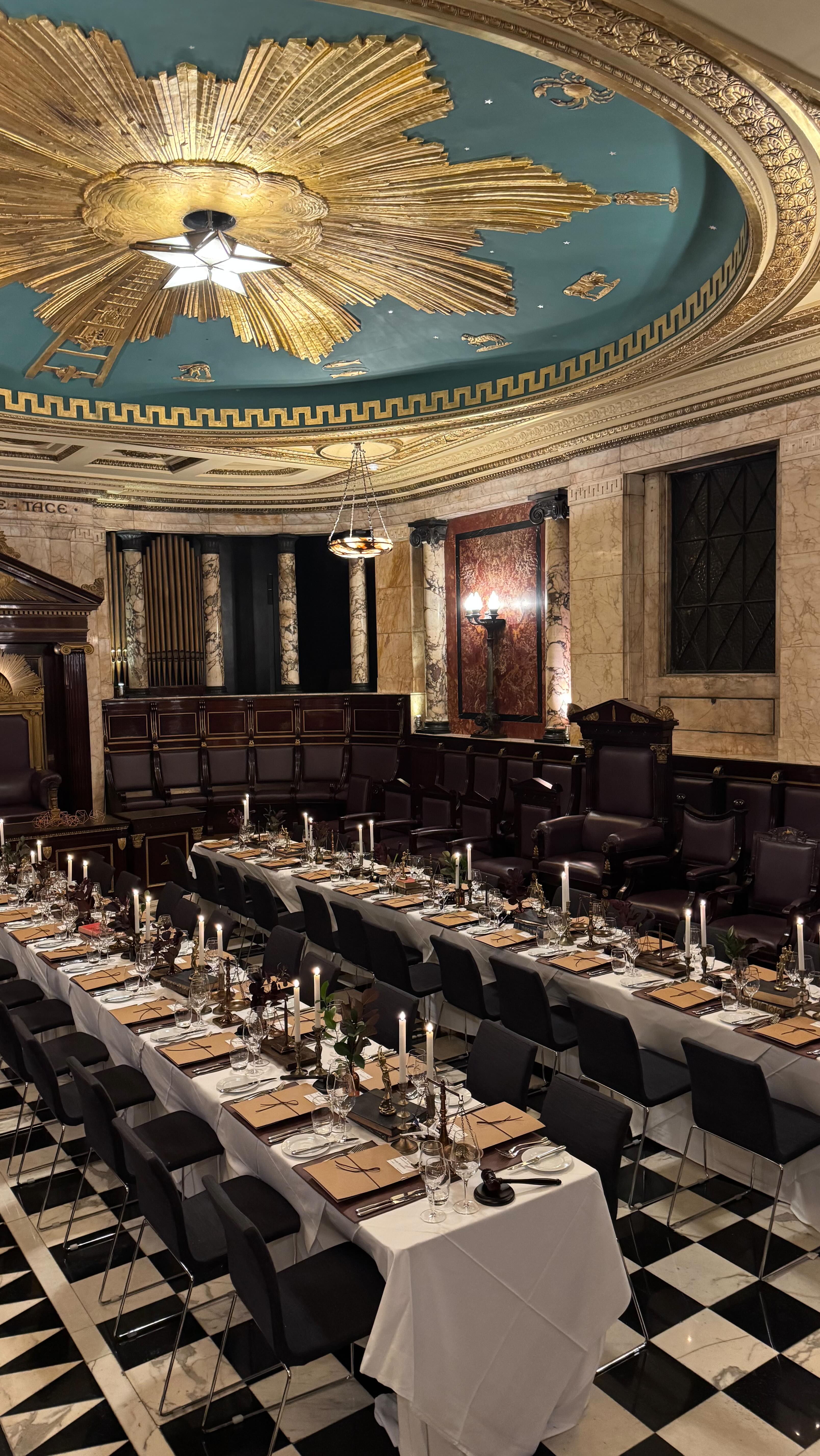 The venue sets the stage — and sometimes, it’s a showstopper on its own. This room- The Masonic Temple at Andaz Hotel Liverpool Street was discovered by our client, and what a find it was.
Marble pillars, wood panelling, and over a century of history gave us the perfect setting to stage Alex’s “trial of misdeeds.” Our role was to build on the drama already in the room and make the tablescaping feel seamlessly at home in such a striking space.
Since starting Cushte, we’ve discovered so many beautiful venues across London — often hidden gems we’d never have come across otherwise. Pairing our styling with spaces like this is one of the best parts of what we do.
At Cushte, we specialise in interpreting venues — finding ways for the styling to enhance the architecture, story and atmosphere, so every detail feels intentional. When the theme and the space are in sync, the whole event becomes unforgettable.
✨ Have the perfect venue? Let us bring it to life with styling that tells your story.
#eventstyling #luxuryparties #cushte #andazlondon #eventprofs #tablescapestyling #immersiveevents #luxuryeventstyling #eventcreatives #uniquetablescapes #privatediningvenue #eventinspo