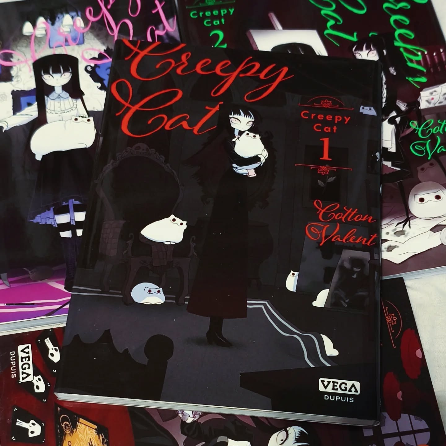 Creepy Cat by Cotton Valent.
It's a 4 vol short stories about a girl who lives with a demon cat. It's for everyone, kids, adults. So if you're not into horror you can still enjoy it, it's a very feel good read with a goth aesthetic.
It's honestly too expensive (at least in France) given the amount of pages so I'd recommand to find a second handed version though.
But it's a very feel good goth kind of reading that I enjoy.