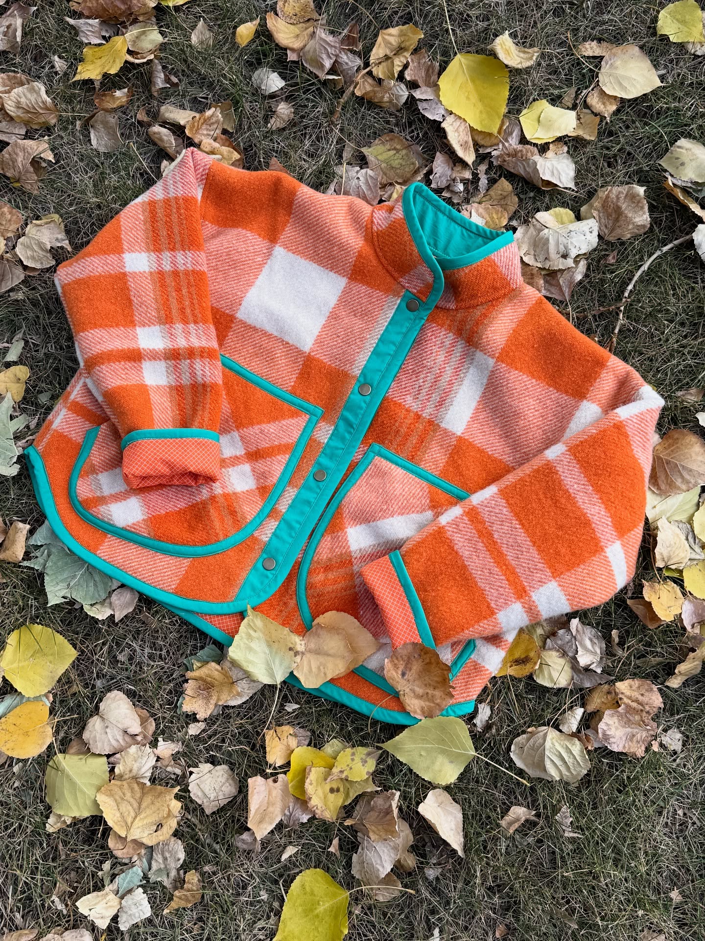 My daughter and I have been busy making quilt coats, and now we're starting to make a few with blankets… this one being a fun retro one from New Zealand. Find this and more @thelakeshandmade. Links in bio.
Happy Taylor Swift album release day to those who celebrate ❤️🔥 This is The Life of a Showgirl jacket — one of a kind, stitched from a repurposed vintage orange plaid wool blanket with bold patina green accents. She’s timeless, fiery, and full of main-character energy. Highly considering making more era-themed coats… 👀 And she’s now live on Etsy!
#thelifeofashowgirl #sustainablefashion #slowfashion #vintageblanketcoat #quiltcoat #upcycledfashion #florajacket #oneofakind #shopsmall #fallfashion #taylorswift #taylorsversion #swiftie #theerasstour @taylorswift @taylornation @brightsidefabricco