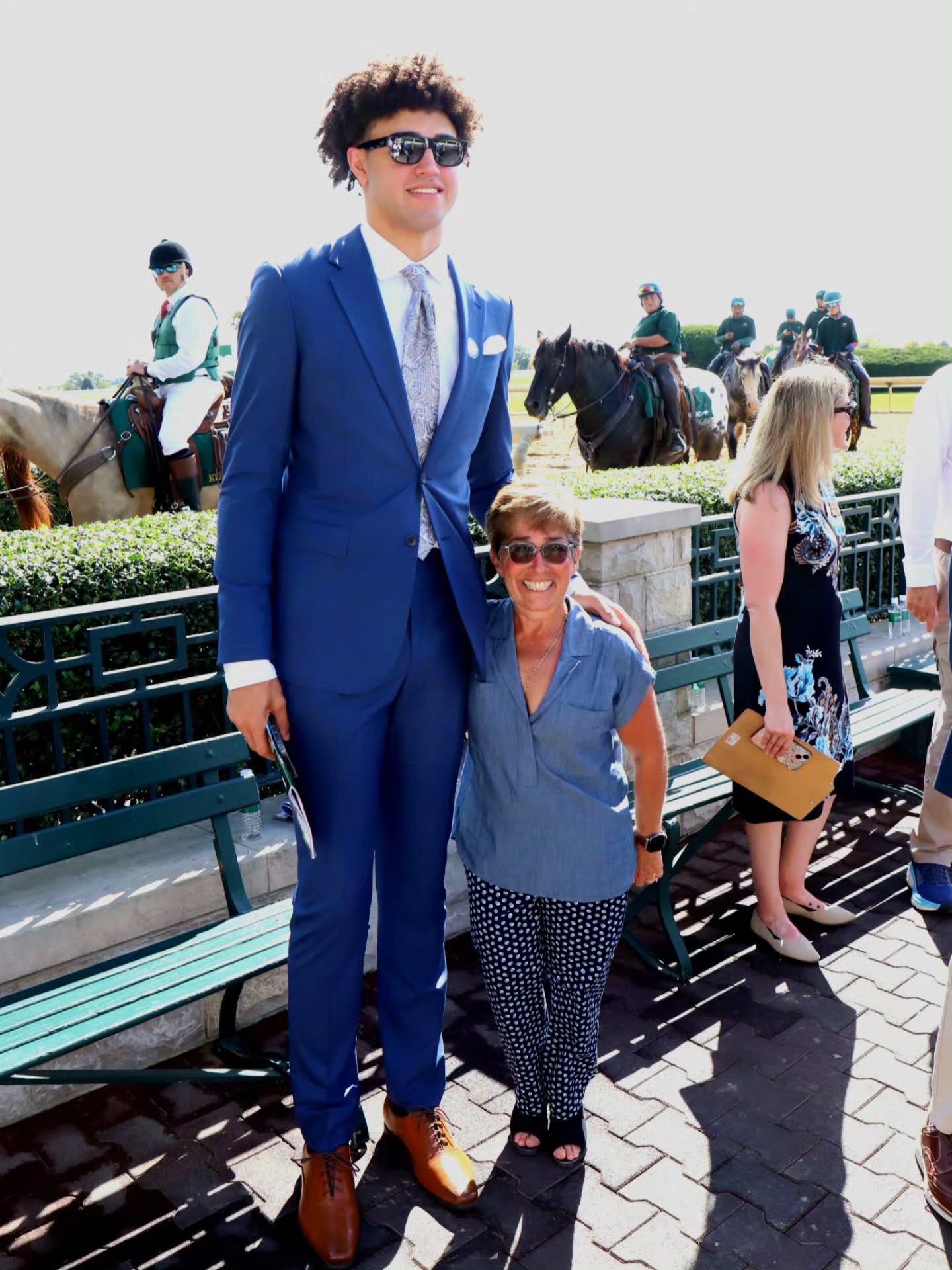 Terrific day at the track. More on that later but just know that @tfox64 is doing her part to hype up the @kentuckymbb program - making them feel even bigger than they are!! Here she is with 7' freshman center Malachi Moreno.