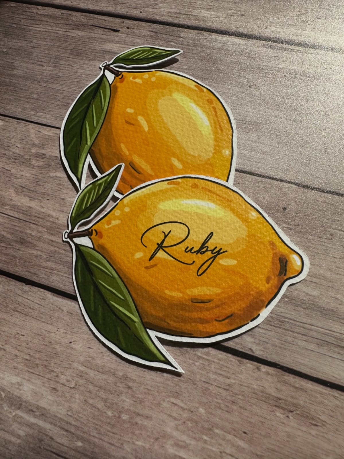 A close up of these lemon place names ✨🍋
•
#placenames #lemonplacecards #lemonplacenames #illustratedplacenames #onthedaystationery #weddingstationery #illustratedlemons #italianweddingstationery