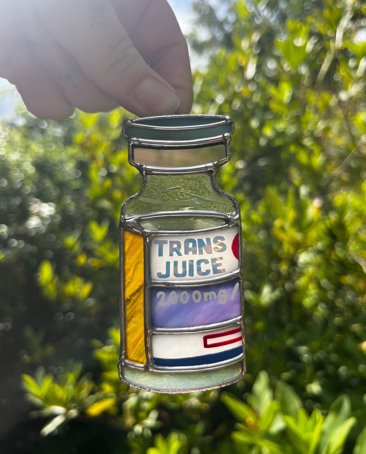Time for that juice! 💉🏳️⚧️ if you go with me anywhere remotely nature-y, I may or may not be carrying around a few glass pieces to random photograph like this. This design has it all - mirror, painting, vinyl, and made by a real life trans person™️! Still have this one available after Pride!