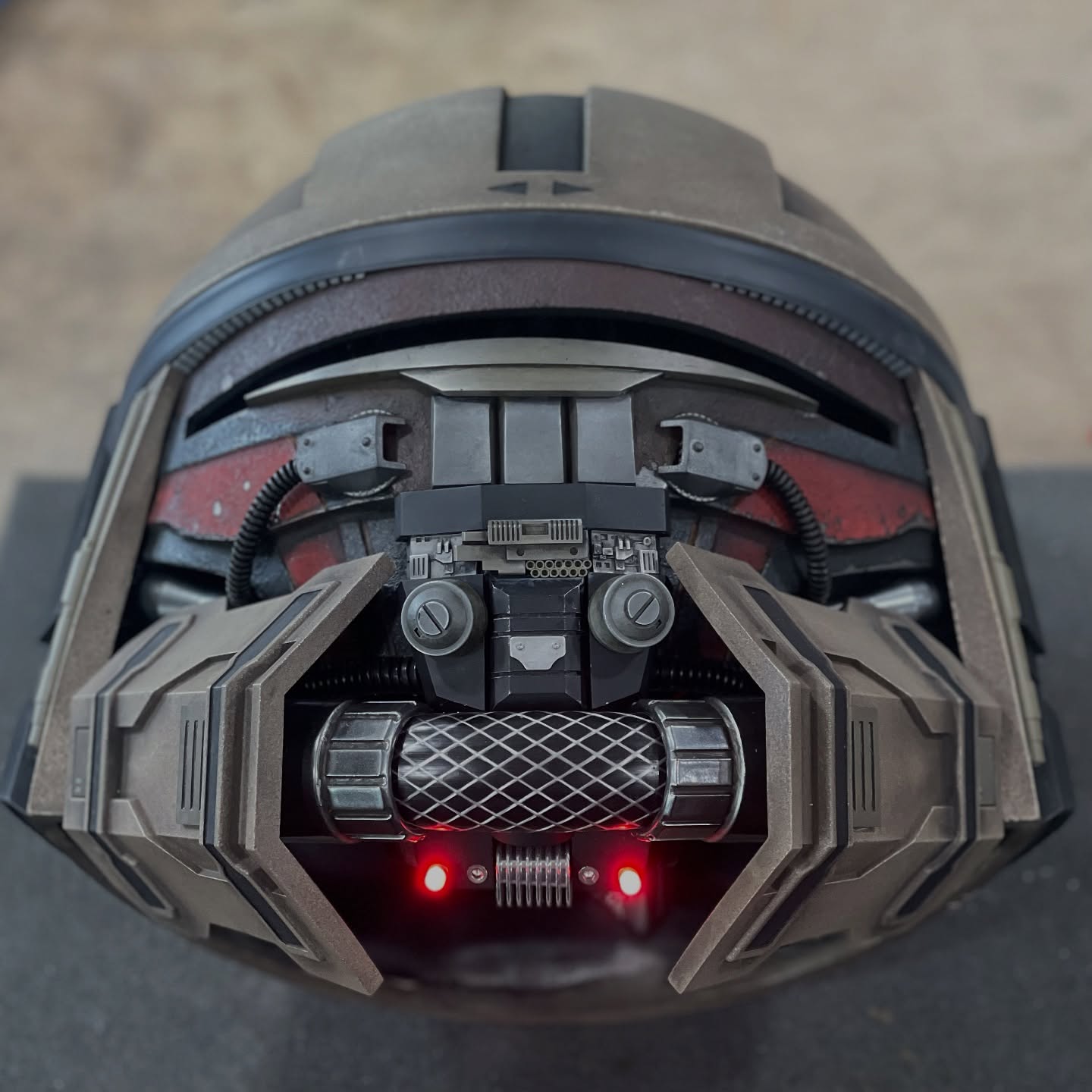 Star Wars Pirate/Mercenary helmet WIP. This is a kit-bash, combining my Mandalorian Recon V2 helmet top with a Revan mask pulled from a 12 year old mold for the face plate. Some of the medium-size pieces come from my Shae Vizla and Sith Acolyte armor projects. Smaller greeblies are from model kits, 3D printer parts, and other “junk drawer” goodies. Still lots of work to do on this one: more painting, more weathering, more LEDs, more customization on the Recon portion of the helmet, visor, padding, etc etc. I’m documenting this build in my stories if you’re interested, but I’ll do a post when the helmet is finished breaking down all the components, showing where they’re from and how I put them together/painted them. Thanks for looking! #mynocksden #starwars #wip #kitbash #kitbashing