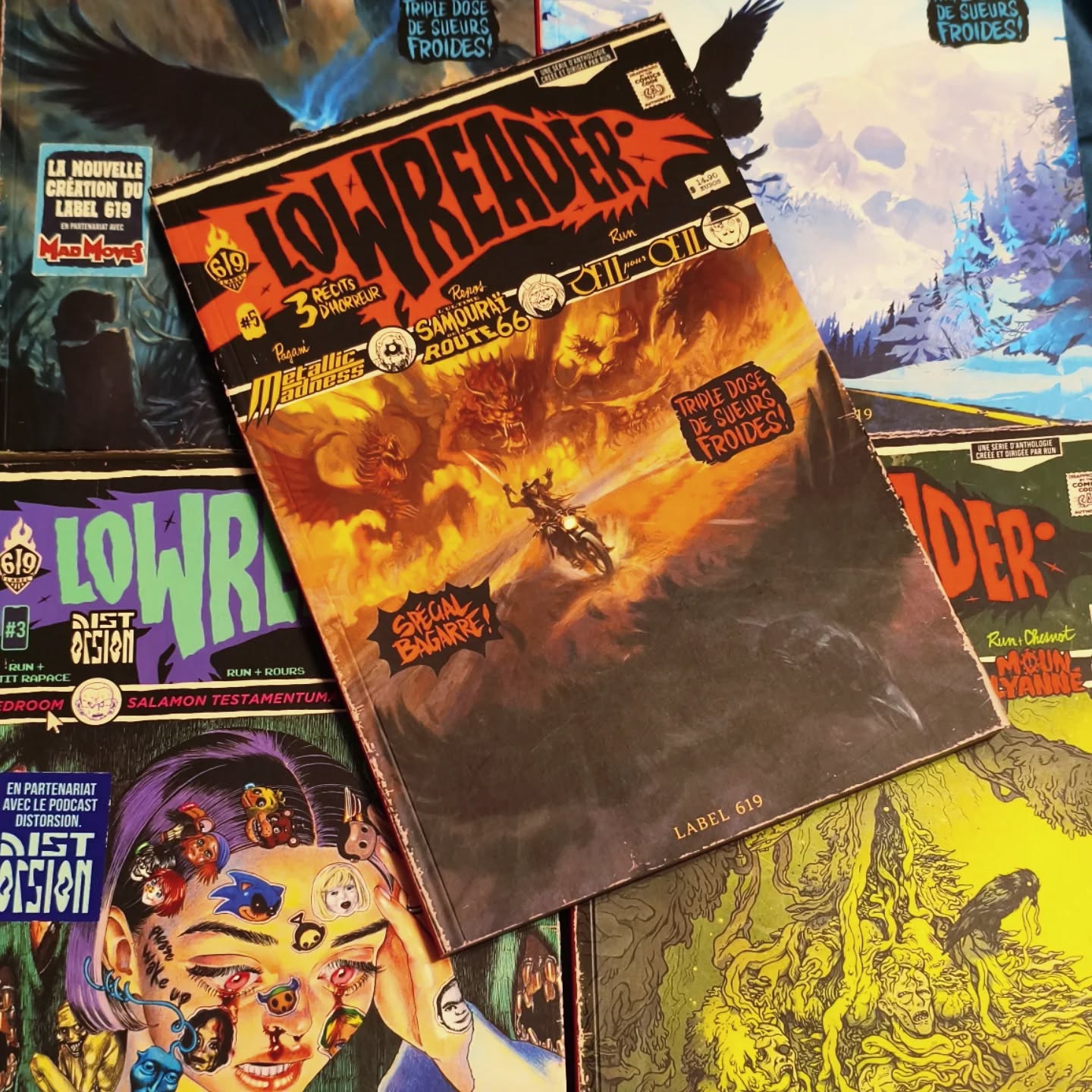 Lowreader.
There's 5 so far, it's a French only comics with 3 short horror stories by different artists. There's gore so beware if you're not into it but it's a very nice read.
I love the old US comics vibe with the covers and fake ads inside. You also have more details and explanations about the main theme of each stories. They're very complet. I hope they'll do more.