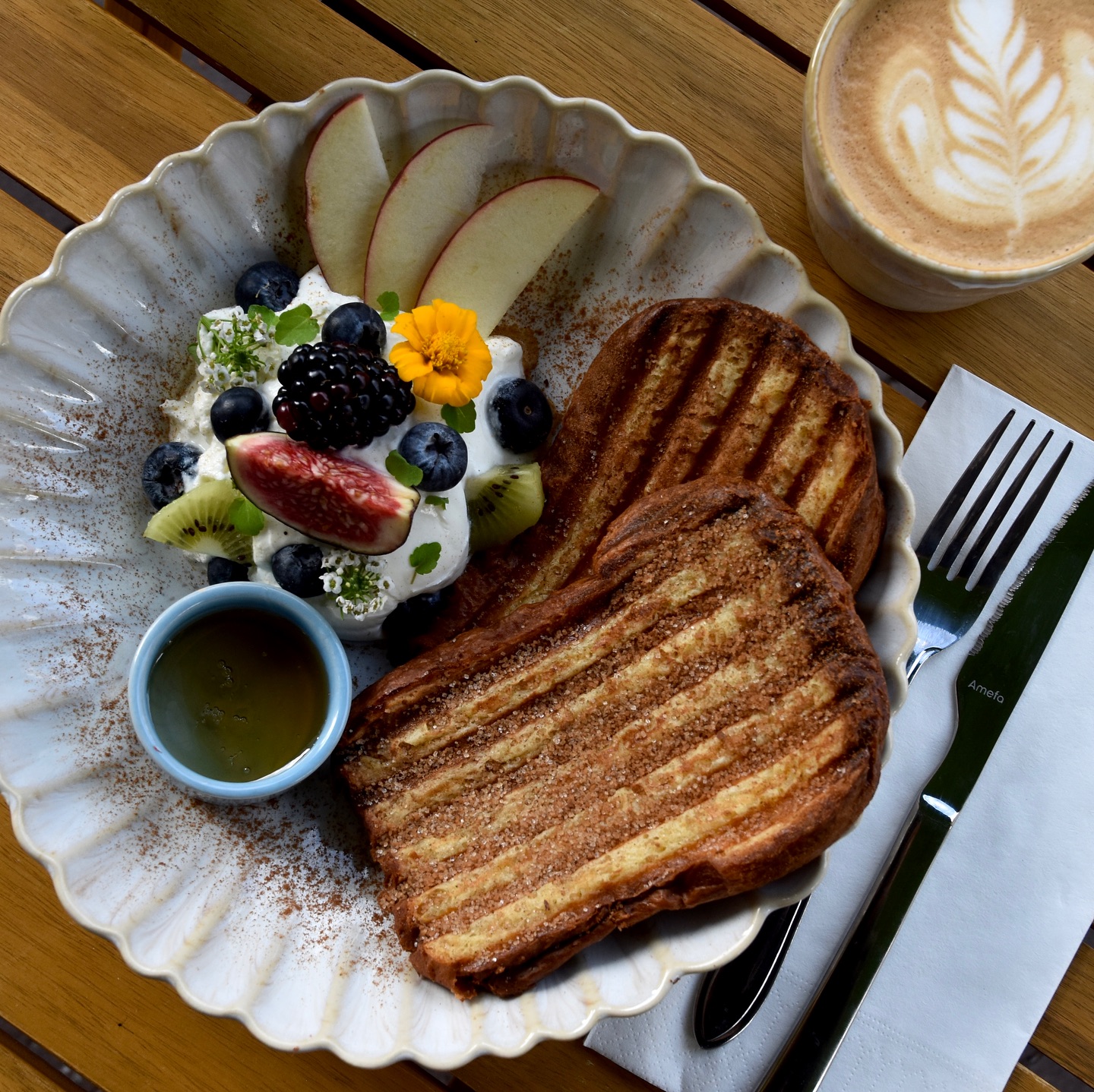 Our french toasts are toasty warm from our grill, topped with cinnamon sugar, and on the side we serve fresh greek yoghurt, a variety of seasonal fruits, honey to drizzle, and optional - a side of warm crispy bacon… this is a warm, loving , sugary, but possibly also savory dish, good for breakfast, lunch, or anywhere in between.🍞🍯
•
•
•
#haarlem #hazel #hazelhaarlem #haarlemcity #cafe #restaurant #coffee #breakfast #lunch #frenchtoast #wentelteefjes #cinnamon #cinnamonsugar #fruit #cappuccino #lattéart