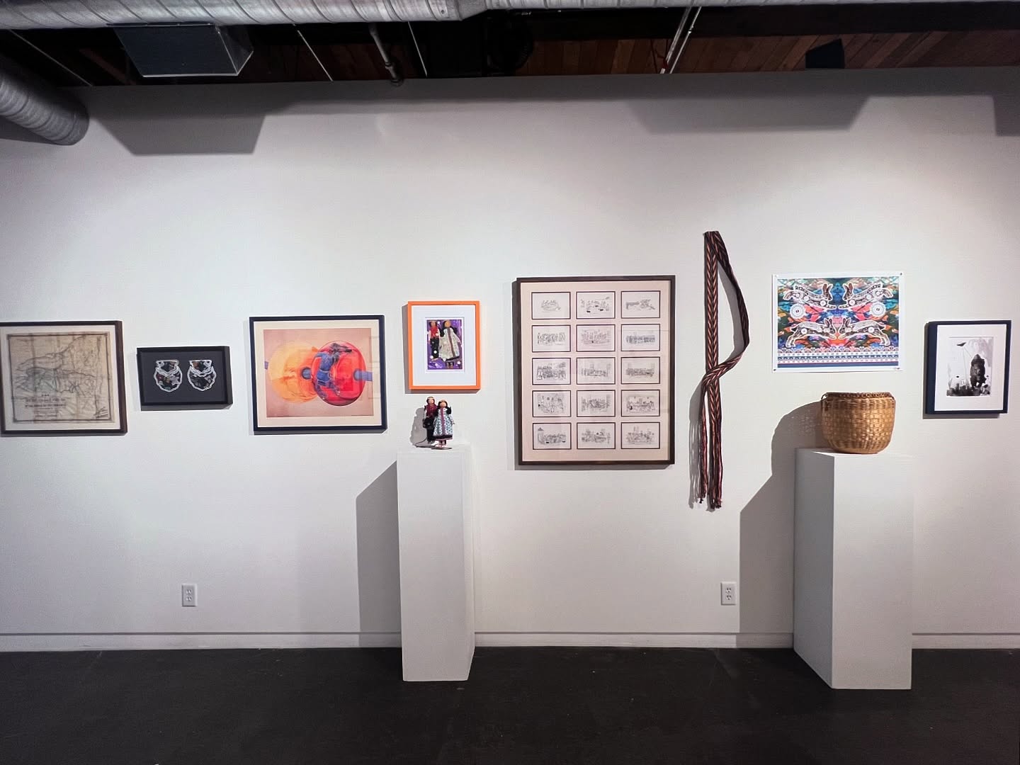 Next up the wall of Dr. Sam Aros-Mitchell @samarosmitchell and Rosy Simas @rosysimasrosysimas . Dr. Sam Aros-Mitchell is an enrolled member of the Texas Band of Yaqui Indians and an interdisciplinary artist, scholar, and educator. His work spans performance, sound, design, choreography, and embodied writing. He leads projects that activate space, deepen community connections, and honor Indigenous knowledge through movement, storytelling, and public engagement. Rosy Simas (Seneca Nation of Indians, Heron clan) is a transdisciplinary and dance artist. Her knowledge of her Hodinöšyö:nih family and lineage is the underpinning of her relationship to culture and history—stored in her body—expressed through her work—of moving people, images, and objects that she makes for stage and installation. Simas is the Artistic Director of Rosy Simas Danse and a 2024-2026 Walker Art Center artist in residence.
Works from left to right: Map of Ho-de-no-sau-nee-ga or the Territories of the People of the Longhouse in 1720, Raised Beadwork Pouch-Hodinöhsö:ni’- Artist Unknown-Circa 1880, Woodland Dancer - Reflections in Red and Yellow-2005, Carson Waterman (b.1944) Seneca Nation of Indians, Cornhusk Dolls-circa 1970-Clarinda “Cleo” Waterman (1901-1987) Seneca Nation of Indians, Cornhusk Dolls-2022-Frank Buffalo-Hyde-Onondaga/Nez Perce, Iroquois Indian Games and Dances-1903-Jesse J. Cornplanter (1889-1957) Seneca Nation of Indians, Change and Flow-2025-Elisha Ieshonténhawe King 1st Place Traditional Arts Hodinöhsö:ni’ Art Show & Market 2025-Mohawk, Ash Basket-circa 1970-Nettie Huff Watt (1901-1987)
Seneca Nation of Indians, In the Thicket - Eastern Cottontail Rabbits-2025-Kayeri Akweks-Six Nations, Black & White Sketch #8-2023-Frank Buffalo Hyde-Onondaga/Nez Perce. Opening October 18th 6-9pm.