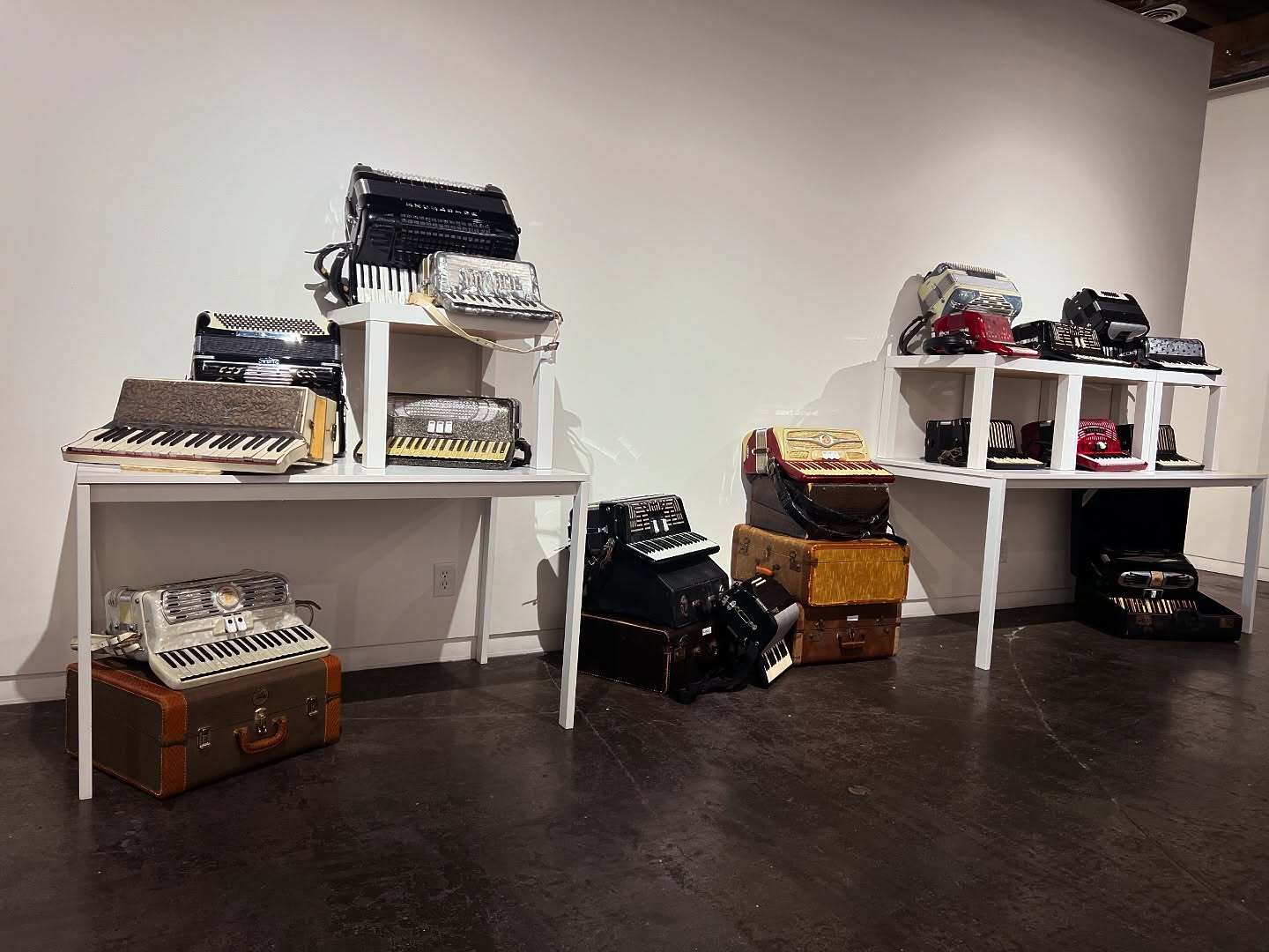 Collect Call 6 opens October 18, 6-9pm. Today’s Wall Highlights Patrick James O’Brien Maria Cristina (Tina) Tavera’s Father & Xavier Tavera’s Father-in-Law. Tina and Xavier put together “The Accordion Sanctuary”. @taveraxavier @tina.tavera
For Patrick James O’Brien, collecting came as a pure miscalculation. Some years ago, Mr. O’Brien discovered eBay as a pastime. In his first interaction with the platform, he bet on an accordion with the intention of enticing an ongoing auction and saw the betting number change almost immediately. He did that a couple more times, enthusiastically, just before the auction closed. For the last minute, a minute that seemed eternal, the number didn’t change, nobody raised his bet, and the realization sank in that meant that he had won, and the prize was a beautiful accordion that he didn’t intend to buy.
The thrill of the hunt moved him to the core; he started to place bids in different accordions: some with keys, others with buttons, some diatonic, some piano, one bandoneon, and a couple of concertinas, Roland, Rosetti, and of course, Hohner. The searches made him study and analyze buyers and sellers. If the accordion had a low price but it looked aesthetically fine, he knew there was a malfunction in the accordion; if the accordion was too expensive but the seller didn’t know basic accordion vernacular, the whole sale could be a hoax.
Mr. O’Brien, an avid accordion player, admirer of polkas and Mexican Norteña music, enthusiast of Conjunto and occasionally and advocate of Cumbias (as long as they include an accordion), taught himself the intricacies of the function and operation of accordions, he learned how to fix them with basic, household tools and soon he was replacing keys, bellows, air buttons, decals and grills. This labor of love and devotion to restoration has led to the mastery of detailing and craftsmanship through the improvisation of repair processes. This is a provocative counter-narrative to the unsustainable throwaway society in which we live.