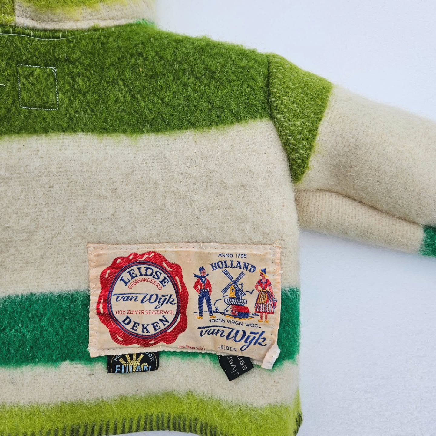 Once a blanket, now a little handmade woolen jacket💚🤍