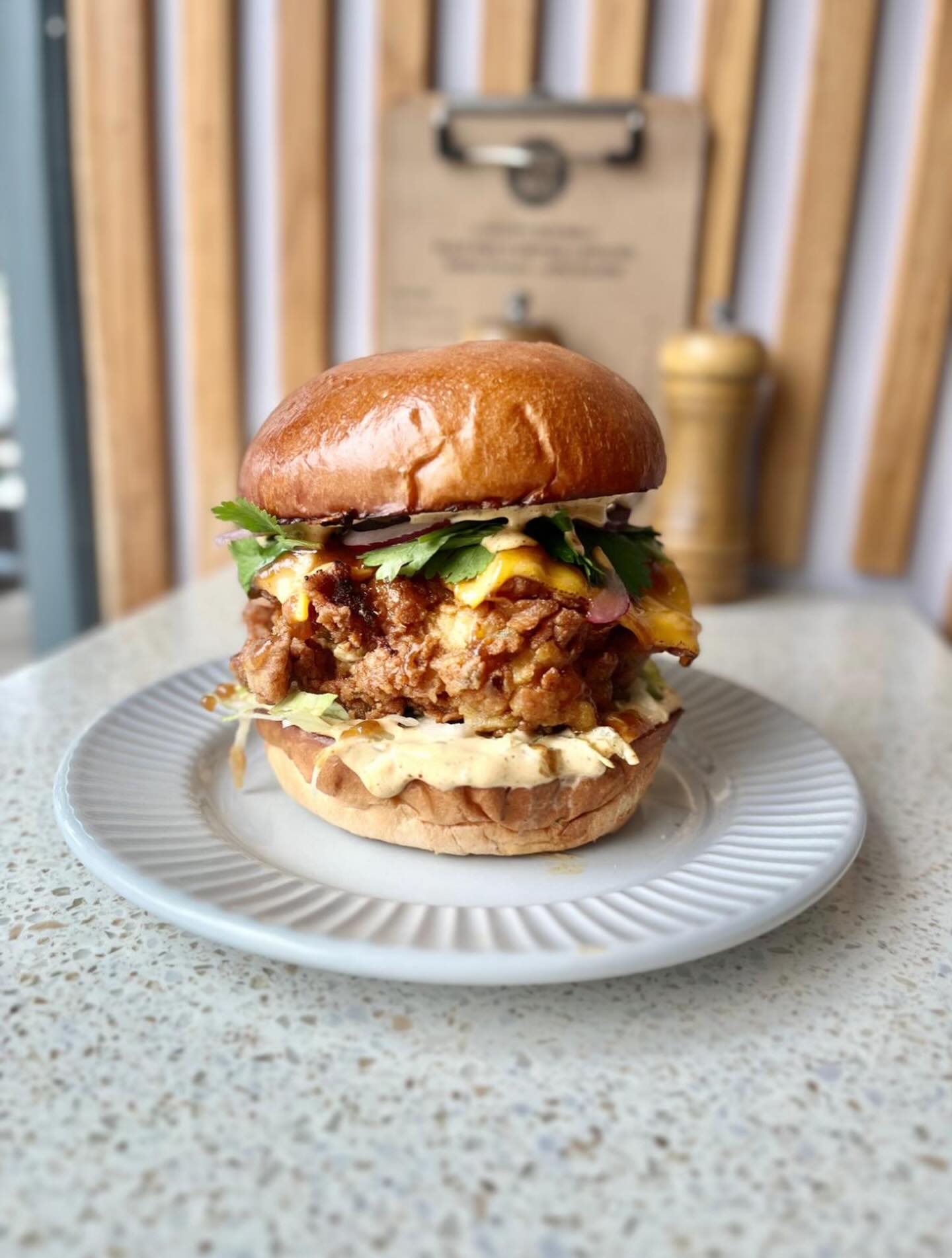 Belting burger on for lunch this week! Kerala fried chicken, curry leaf mayo, tamarind glaze, cheese, red onion.