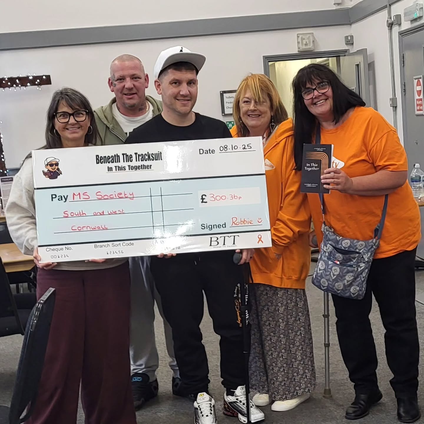 I'd have never thought id have moments like this! 🧡🎗
From the Book "In This Together" we raised £300 in the first 3 months and it was such a privilege to be able to pass this oversized really awesome Beneath The Tracksuit cheque to the south west Cornwall MS Society group yesterday so they can fund something for people with MS 🧡
Thank you to everyone that shared your words for the book and thank you to everyone who has brought to book.
Together we can make a difference to people with MS 🧡🎗🙌
#multiplesclerosis #MSawareness #mswarrior #inthistogether #beneaththetracksuit