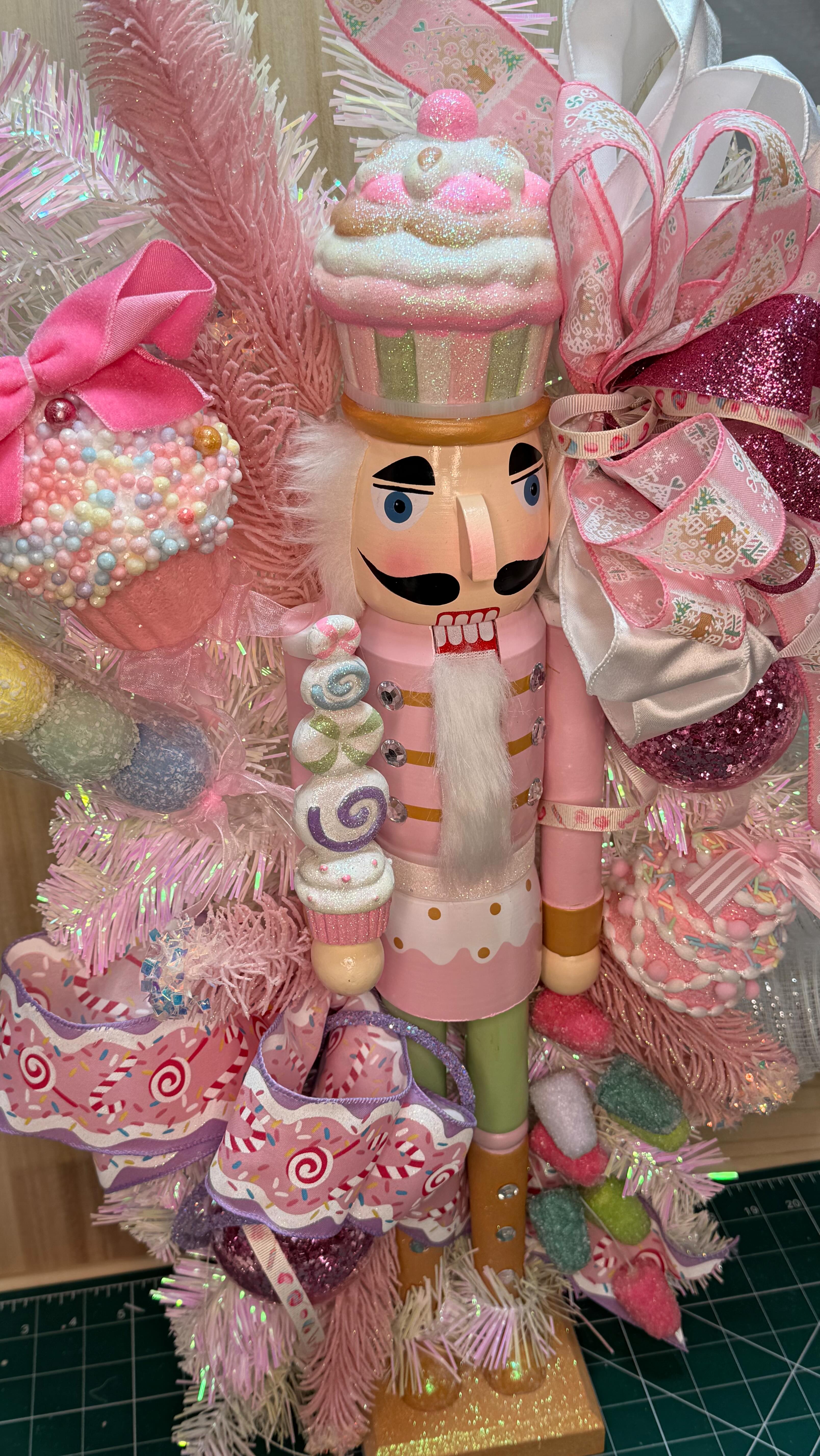 Candyland Nutcracker!! This one can be hung or stand as a centerpiece on a mantle! It’s bulb light up and it’s adorned with gum drops and candy cakes!! Grab it today before it’s gone!! www.whimsywonderswreathco.com #wreathmakers #candy #candyland #nutcracker #homemadewithlove❤️