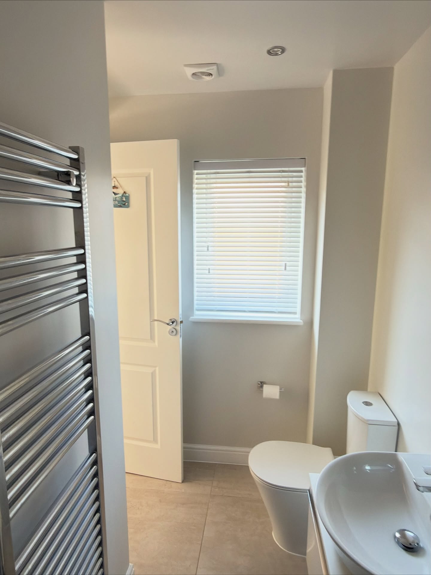 A beautifully refreshed en-suite, painted with premium, wipeable eggshell paint. Damaged silicone sealant around the shower and floors was removed and replaced, and ceiling repairs were also carried out.