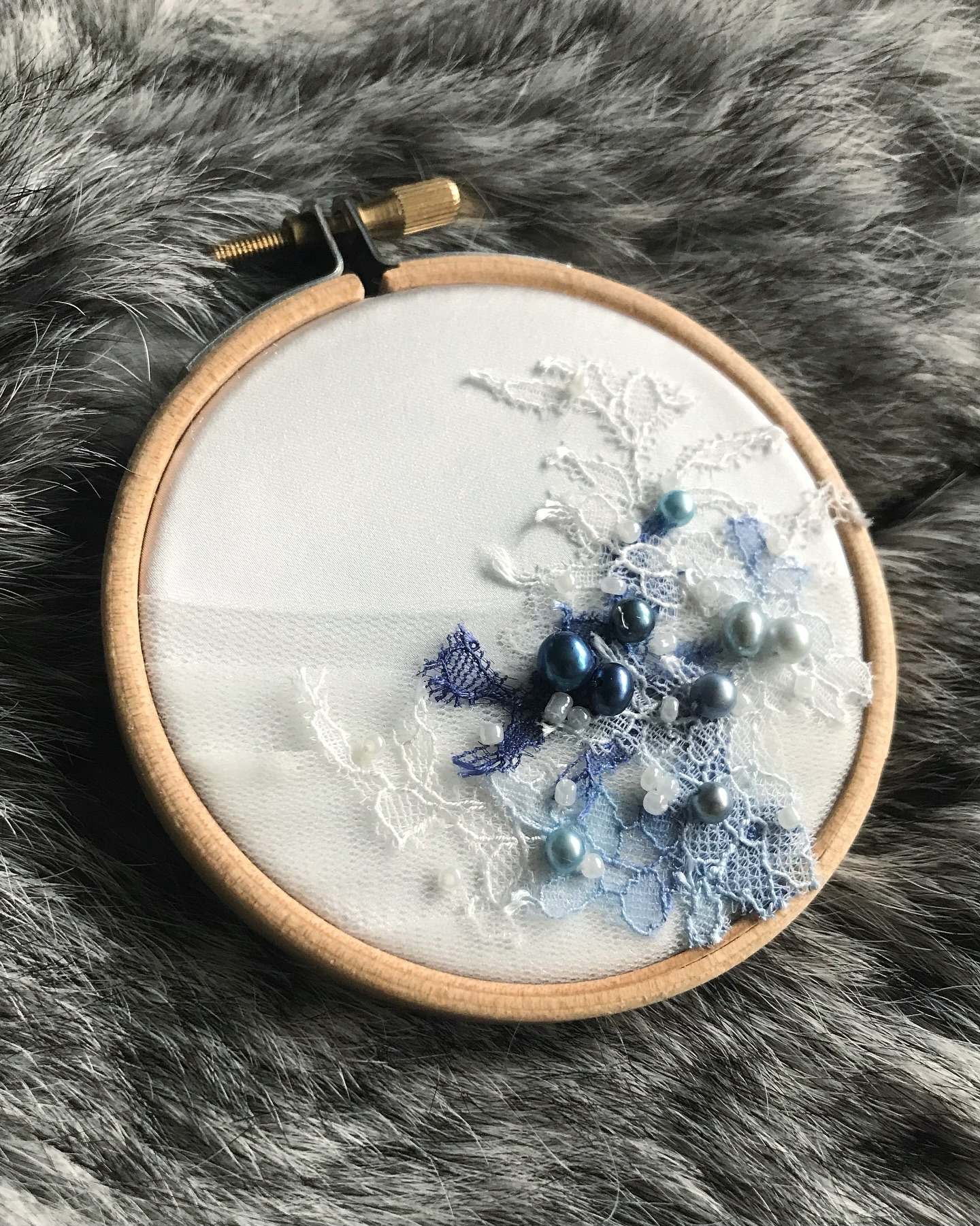 • Eleanor •
A keepsake stitched as a memory.
For this bride, I created my first miniature embellished hoop, a small memento capturing the story of our work together. Using fabrics from her gown, I layered pleated tulle, hand-painted lace, and soft blue toned freshwater pearls, echoing the details of her bridal look.
A beautiful reminder of the day she felt absolutely radiant. Something she can hold, display and return to whenever she wants to remember.
Pieces of her gown, forever suspended in time.
#EmiahCouture #Emiah_Bespoke #Emiah_Bridal #Emiah_Bride