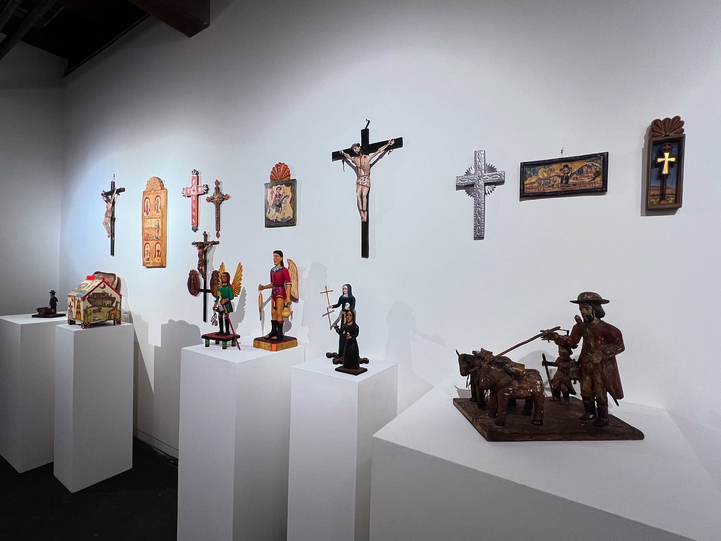 Today we celebrating Blaine and Lyndel King’s Wall, featuring work from the Spanish Market in New Mexico. Collect Call 6 opens this week, Saturday October 18th 6-9pm. Lyndel and Blaine King grew up in rural Kansas and graduated from the University of Kansas in Lawrence. They came to Minneapolis to go to graduate school. Blaine wanted to teach journalism and enrolled in the well-respected American Studies PhD program. Lyndel had majored in microbiology and chemistry and worked as a chemist in Lake Charles, Louisiana, while Blaine served in the Army. Later, she worked in a virology lab at the University of Kansas while Blaine served as an interim professor in the journalism school. In Minnesota, she enrolled in the graduate program in art history.
Before they moved to Minnesota, they saved all their money and, armed with loads of books and a tent purchased in Paris, spent nearly six months driving a leased car through Europe, learning art history the old-fashioned way—by looking at real art.
Blaine dropped out of graduate school for a career at the Minneapolis Star Tribune, working as a copy editor, reporter, editor, and project manager. Lyndel earned a PhD, worked for a local computer company, and as director of the University Gallery in Northrop Auditorium, which became the Weisman Art Museum. She worked with architect Frank O. Gehry to design the museum, which opened in 1993 and underwent an expansion by Gehry in 201. She retired during COVID.
Lyndel’s two sisters live in New Mexico, and during her childhood, she often traveled to Santa Fe with her family — her hometown in Kansas was closer to Santa Fe than to Kansas City. She dragged Blaine to Santa Fe early in their life together, and the rest is evident in this exhibition.