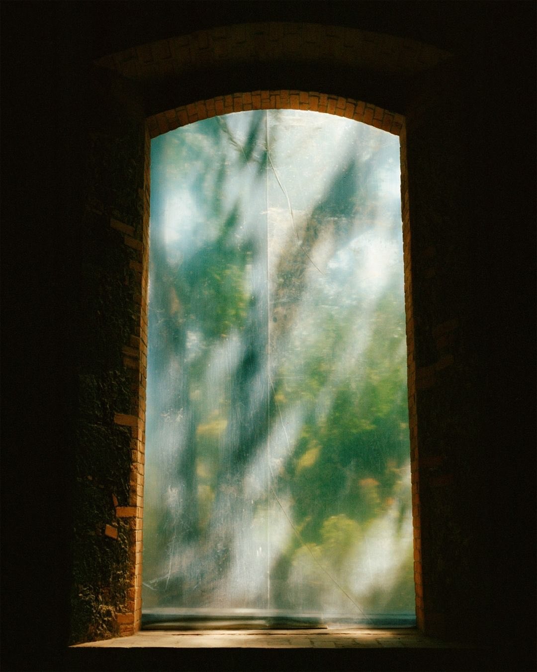 …For Tereza Červeňová, photography begins in a sunlit moment, a fleeting alignment of light and form, a shimmer of time suspended. Then comes the darkroom, the alchemical counterpoint: film wound, paper curved in her hands, gestures repeated until the image takes shape. “Analogue material is very fragile, yet it is rich in tones and densities,” she reflects. “It needs care and gentleness. The alchemy stored within the print turns a moment in time into ephemeral eternity; the light that gives photography its life also makes it slowly perish.”
…
Her latest body of work explores the invisible violence of domestic abuse through self-portraits, vernacular scenes, and fragments of speech. These sit in contrast to narratives that are often reduced to statistics or broad statements. This is part of what gives her practice its urgency. Červeňová encourages conversations that often remain unspoken: domestic abuse, loneliness, belonging, the subtle negotiations of power and care within families and partnerships. Sensitivity, in her work, is a refusal to look away at the aftermath.
New article about @tereza_cervenova by @rosieclemhen on our website now!