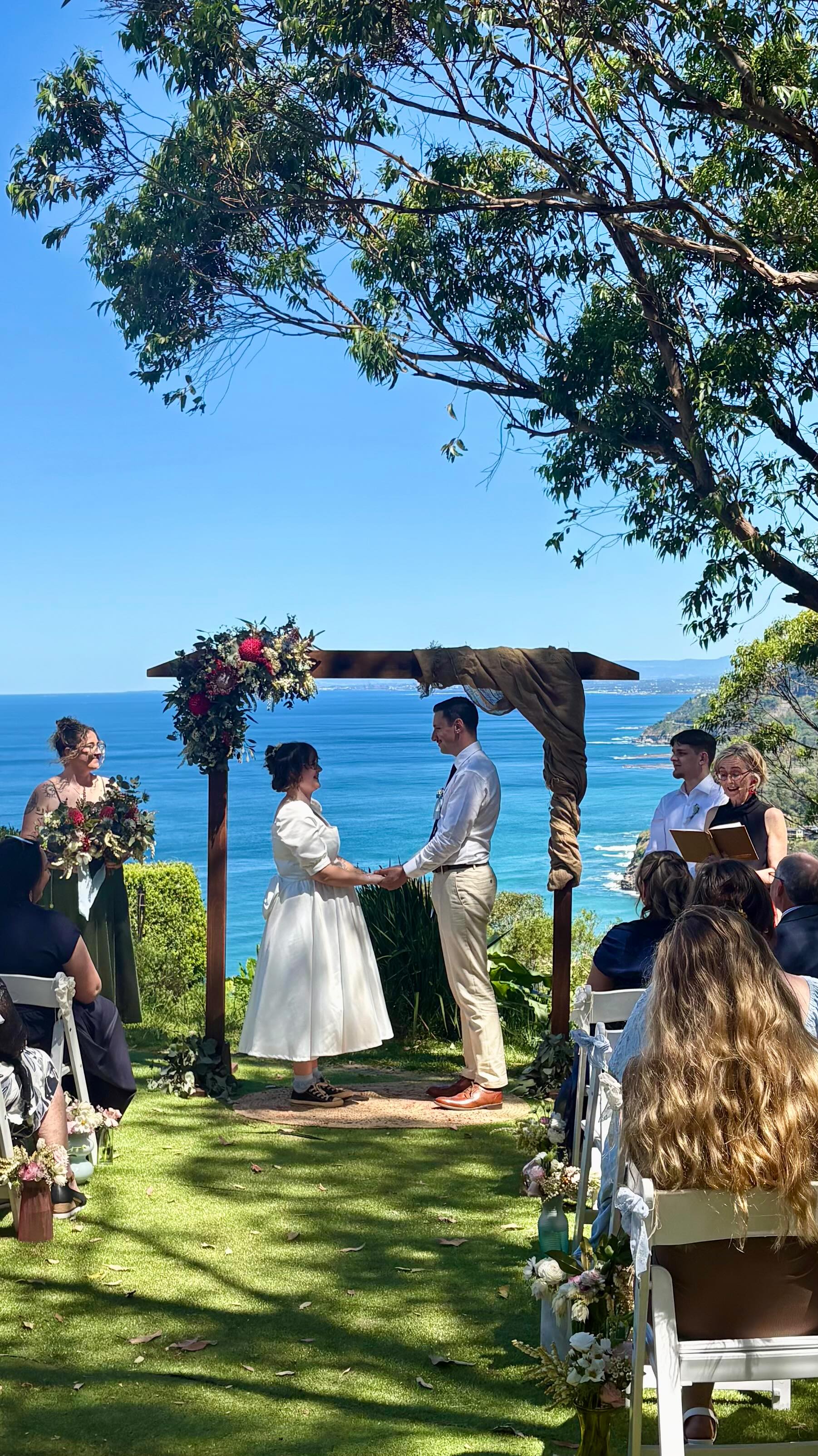 Congratulations to Caitlin and Hayden 10/10/2025 wedding
@interbanestanwellpark for an intimate gathering of nearest and dearest. Totally spoilt with the stunning coast line, glorious sunshine, whales breaching and the tears and laughter, and of course plenty of hugs all round💖💖
🤩Family become the photographers, grandmother made the bridal dress, guests gifted their favourite dish, friend become the DJ, and the wedding party did the arbour and florals. Wedding guests loved contributing to making a couple’s wedding day special.
It’s all about doing the wedding in a style that reflects the couple. I love seeing more couples seeking out their wedding style.
#wollongongwedding #wollongongcelebrant #weddingday #illawarracelebrant #savybride #southcoastcelebrant #coastalwedding #wollongong