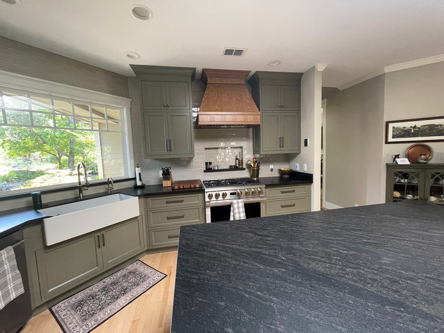 Dark kitchen countertops can serve as a grounding element—especially when paired with vibrant cabinetry. Here, the deep, sophisticated tones of our Nero AB granite countertops perfectly balance the earthy painted green cabinets, creating a harmonious and timeless design.
#NSDG #NATURALSTONE #TILE #INTERIORDESIGN #REMODEL #TILELOVE #DESIGNINSPIRATION#SAC #INTERIOR #SLABS #LUXURY #LUXURYTILE #TILEDESIGN #SACRAMENTO #KITCHENINSPO #BATHROOMINSPO #HOMEINSPO #TILEART #CERAMIC #PORCELAIN #MOSAIC #TILEWORK #LOCALBUSINESS #CUSTOMTILE #STONECOUNTERTOPS