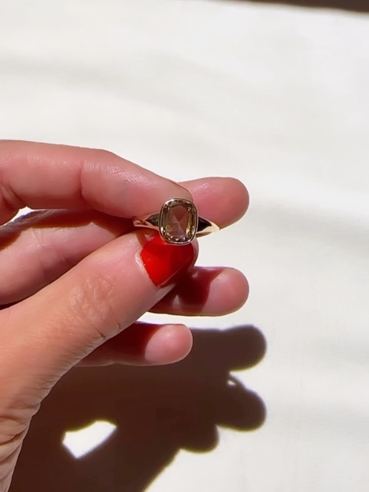 This world seems increasingly crazy but everyday I get to witness people doing things that are brave and beautiful. Choosing to build a life together and say that they choose each other every day. For me, getting to help make a talisman and symbol of this act is a feeling of hope and beauty. An object made to ride along with them through the good days and the bad days and show no marks that make it worse for the wear. This very special brown diamond found its way to them ready to symbolize that love.
Brown diamonds have been known for centuries, with early use in India for decorative purposes and talismans, and have a history in ancient Roman jewelry. These days it’s a beautiful way to create a unique look with a diamond that has trace minerals and differences in the crystal structure when it is forming that give it that rich color. Sometimes it’s the presence of nitrogen atoms that absorb wavelengths of light, giving it this cool brown hue.
Brown diamonds historically symbolize harmony, grounding and a deep connection to the earth and when paired with a simple setting it all felt right for them. Low profile and set in a delicate bezel with a slight knife edge to the band.
All this to match their journey in life together. A real joy to make. ❤️