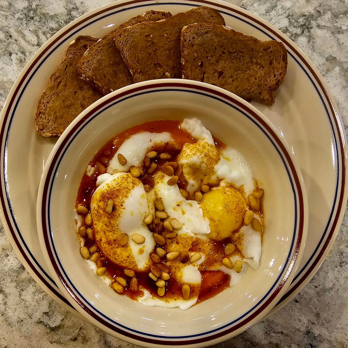 Cilbur (chill-burr).
Turkish eggs. Greek yogurt with garlic and lemon, poached eggs, Aleppo brown butter, toasted pine nuts, whole grain toast soldiers.
Good morning!