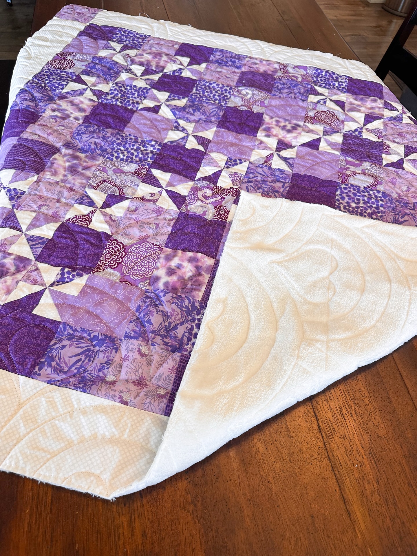 💜 This gorgeous purple quilt was pieced by my sweet client Nancy and longarm quilted by me! 💜 I absolutely love how all these beautiful shades of lavender, lilac, violet, and plum came together — it’s such a stunning mix of fabrics and textures! I quilted it using the Rainbow Hearts pantograph, which adds the perfect touch of soft curves and whimsical heart shapes to complement the geometric piecing. ✨
The backing shows off the quilting beautifully — those Rainbow Hearts really pop on the soft white fabric! Quilts like this one are always a joy to work on. From the pieced stars to the cozy texture, it’s full of love and creativity from start to finish. 💫
If you’re looking for custom longarm quilting services, I’d love to help bring your quilt tops to life! Whether you prefer modern quilting, traditional quilting, or edge-to-edge pantograph designs, I offer professional longarm quilting that highlights your piecing and adds beautiful texture.
#LongarmQuilting #CustomQuilting #QuiltedWithLove #QuiltingCommunity #Quiltersofinstagram #LongarmQuilter #PantographQuilting #RainbowHeartsPantograph #PurpleQuilt #StarQuilt #EdgeToEdgeQuilting #MachineQuilting #QuiltBacking #ModernQuilting #HandmadeQuilt #Quiltsofinstagram #TextileArt #QuiltDesign #LongarmQuiltingServices #omjquilting