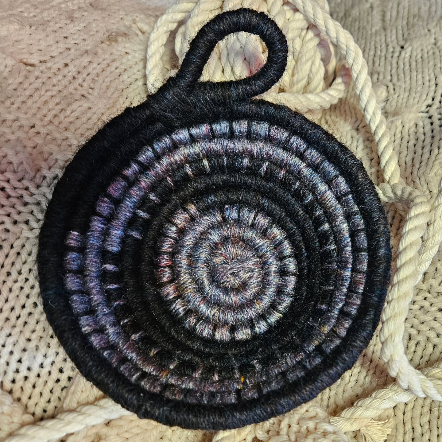 New wool bowl finished! This one featured a deep blue wool blend (unknown wool, just called "colonial wool") and a silvery blue merino/silk blend, both my own handspun yarn wrapped around a cotton rope core. These bowls are as tactile and pleasant to the touch as they are useful. Great to help organize project supplies like buttons and threads, or be a landing place for keys or jewelry or spare change, potpourri or spell components, or any other treasures. They make great gifts for the person who has everything!
.
You can find it first this weekend at the @southsoundmakersmarket Haunted Market at the Parkland Community Center on Saturday, or at the @rockridgecountrymarket popup in Enumclaw on Sunday! (And hurray for the bridge being open in time!)
.
#wool #woolbowl #handspunyarn #handspun #bowl #organization #organizer #handmade #handwoven #handwovenwoolbowl #woolbasket #fiberartist #horsenroundfiberstudio #smallbusiness #womanownedbusiness