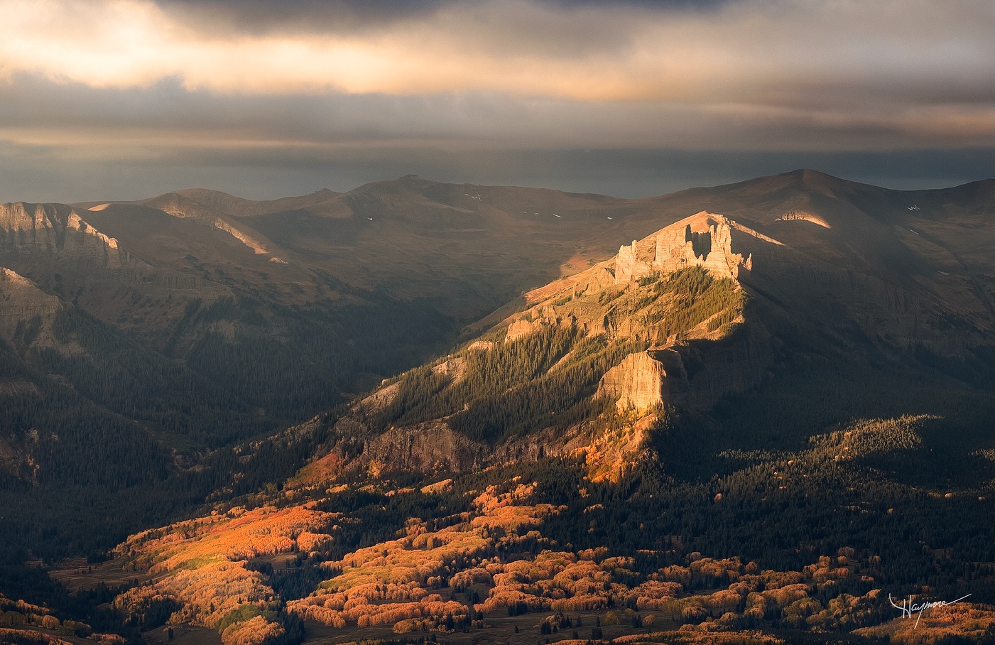 Some unexpected spotlighting and dappled light late morning made for a fun flight.
Aerial perspectives opens up compositions that aren’t possible from the ground. When I saw this large patch of golden Aspens off in the distance, I wanted to get them in the foreground with the raising towers above.
Hovering, waiting, and hoping there would be a moment where light opened up. As I flew over there, the sun burst through and was dancing around the valley, highlighting various features.