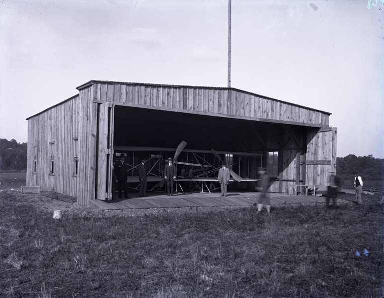 Happy 116th birthday to College Park Airport! This month in 1909, flying at College Park began. After leasing the field, shipping a Wright Flyer here, and building a hangar, Wilbur Wright starting instructing Army lieutenants Lahm and Humphries went up with Wilbur Wright on instructional flights of about 5 minutes each. By the end of the month, after about 3 hours total of flying each, they soloed and the US’s air force was born.
📸: Wilbur Wright at the College Park airfield. A rare image from a never-before published glass plate negative. Courtesy of Arnold Gaus.