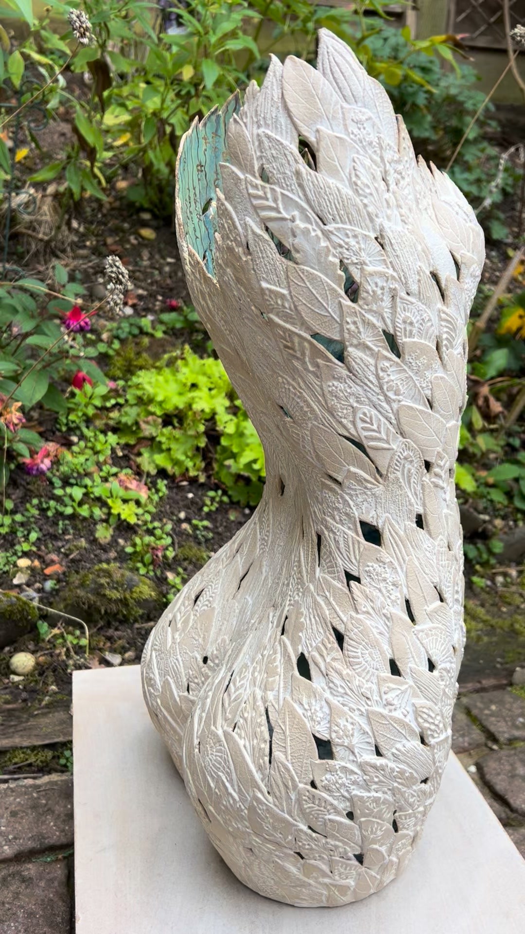 There’s a happy autumn feel in the studio today as my leafy ceramic sculpture comes out of the final firing. What a wonderful feeling to see her come through all those ceramic risky processes.
This week I did some detailed gold lustre work inside the piece. The gold decoration is applied with a fine brush which starts brown and then the piece goes back into the kiln, and the gold is refined. When I open the kiln door the gold gently glints in the light. Such a lovely process.
This sculpture has taken me two weeks to build in clay, nothing else being made alongside her, just full concentration of making her well. She's built leaf by leaf, one by one, “freehand". Each leaf has its own impression or marks added and then is added on. It's a slow methoditive process but one I so enjoy. I've been lost in it completely and loving every minute of it. Seeing the piece grow gently is so exciting. You can find the making process on my profile if you fancy a look.
Then after the first firing the glaze is applied. You can imagine this is slightly challenging with all those little gaps I’ve created in the sculpture. Once I’m sure that glaze is absolutely as I want it I take her up to 1260 C for the stoneware firing.
Then, last of all is the gold lustre detail. All in all it’s taken me over a month to complete her. Such a joyful task.
Next l'm getting a collection ready to release on my website at FayeMayo.com and this piece will be released on there when she's ready. Or I should say when I'm ready to bid her farewell.
If you are interested in the piece or to see my other new releases, please do sign up to my website. I will have some smaller vessels and gift pieces available in due time.
#ceramicstudio #sculpture #ceramicart #golddetail #figurativeartwork #handbuiltceramics #ceramicsculptureculture #pottery